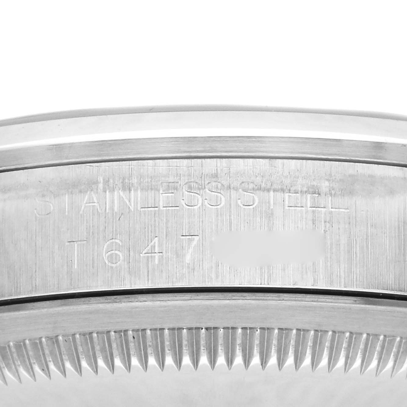 The image shows a close-up of the engraved stainless steel side and case back of the Rolex Explorer 14270 Men
s Stainless Steel Black Dial 14270 Men
s Stainless Steel Black Dial watch.