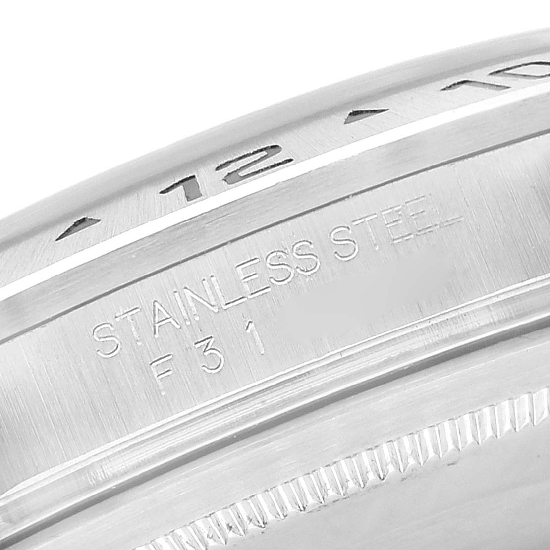 Close-up of the bezel and case side of a Rolex Explorer 16570 Men
s Stainless Steel Black Dial 16570 Men
s Stainless Steel Black Dial watch, showing the "Stainless Steel" inscription.