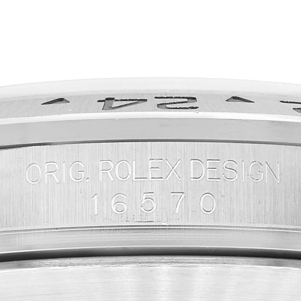 Close-up view of the side of the Rolex Explorer 16570 Men
s Stainless Steel Black Dial 16570 Men
s Stainless Steel Black Dial watch showing the "ORIG. ROLEX DESIGN" and model number 16570 engraved.