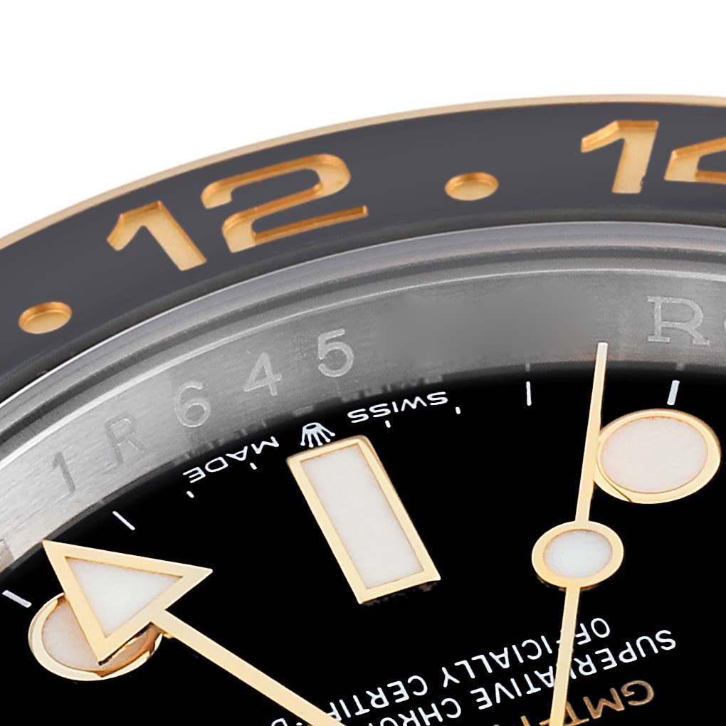 This close-up image of the Rolex GMT-Master 126713 Men's Stainless Steel Black Dial 126713 Men's Stainless Steel Black Dial watch displays the bezel, 24-hour markers, and part of the dial and hands.