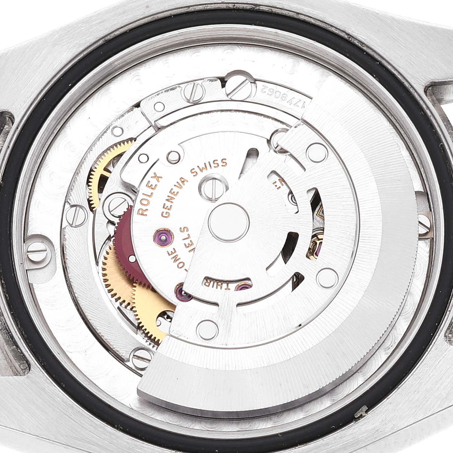 The image shows the internal mechanical movement of a Mid-Size Rolex watch viewed from the back.