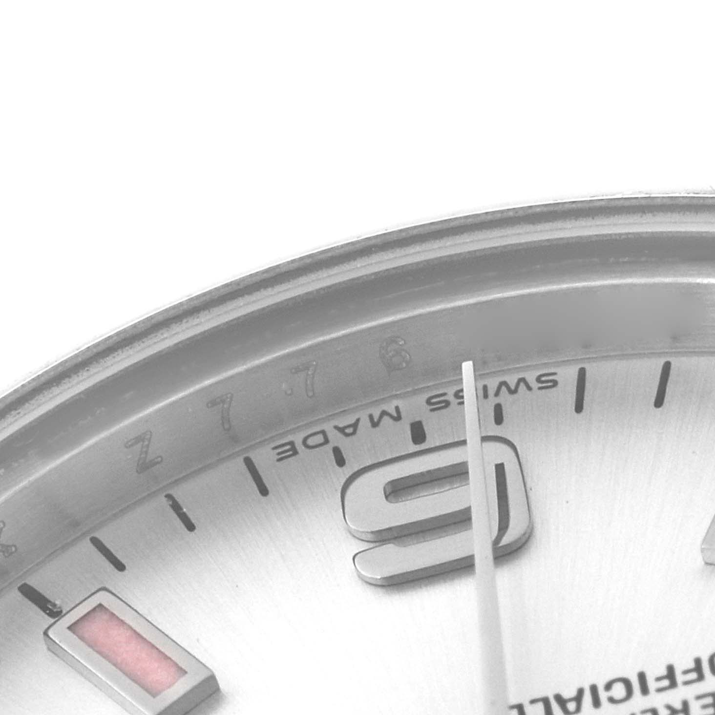 This close-up image shows part of the dial and bezel of a Rolex Mid-Size 177200 Women
s Stainless Steel Silver Dial 177200 Women
s Stainless Steel Silver Dial watch, highlighting the "Swiss Made" text and hour markers.