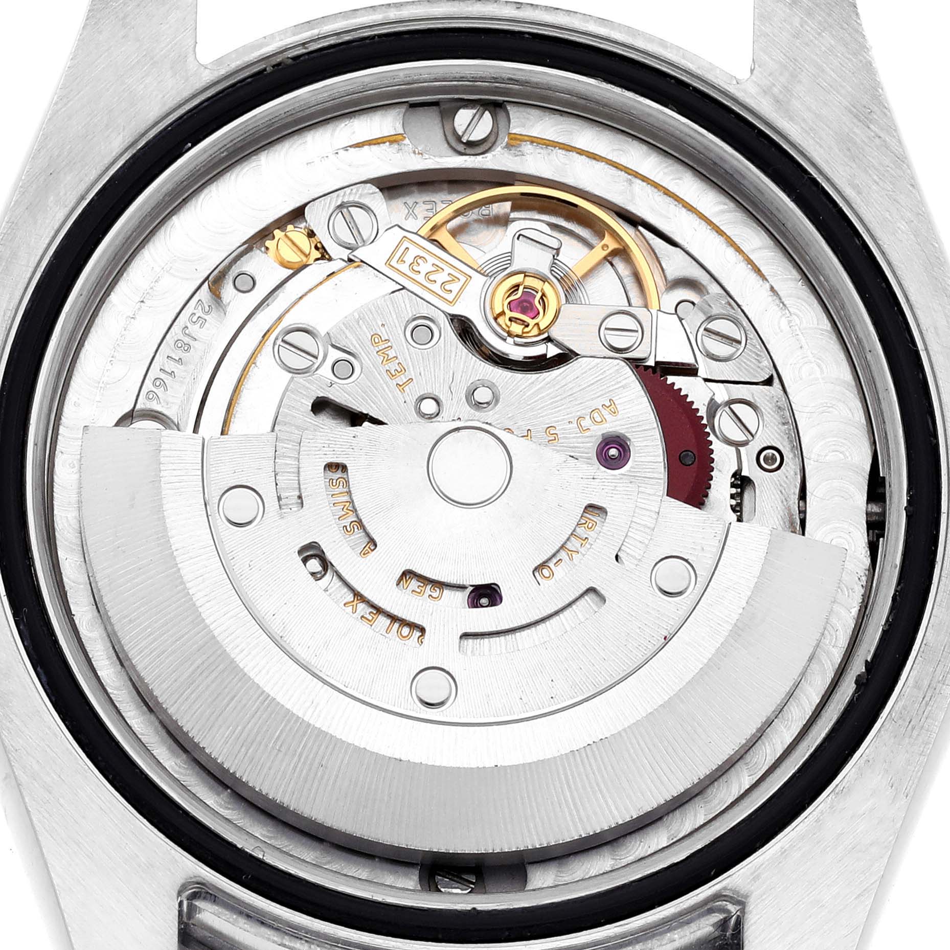 The image shows the movement inside a mid-size Rolex watch from a top-down angle.