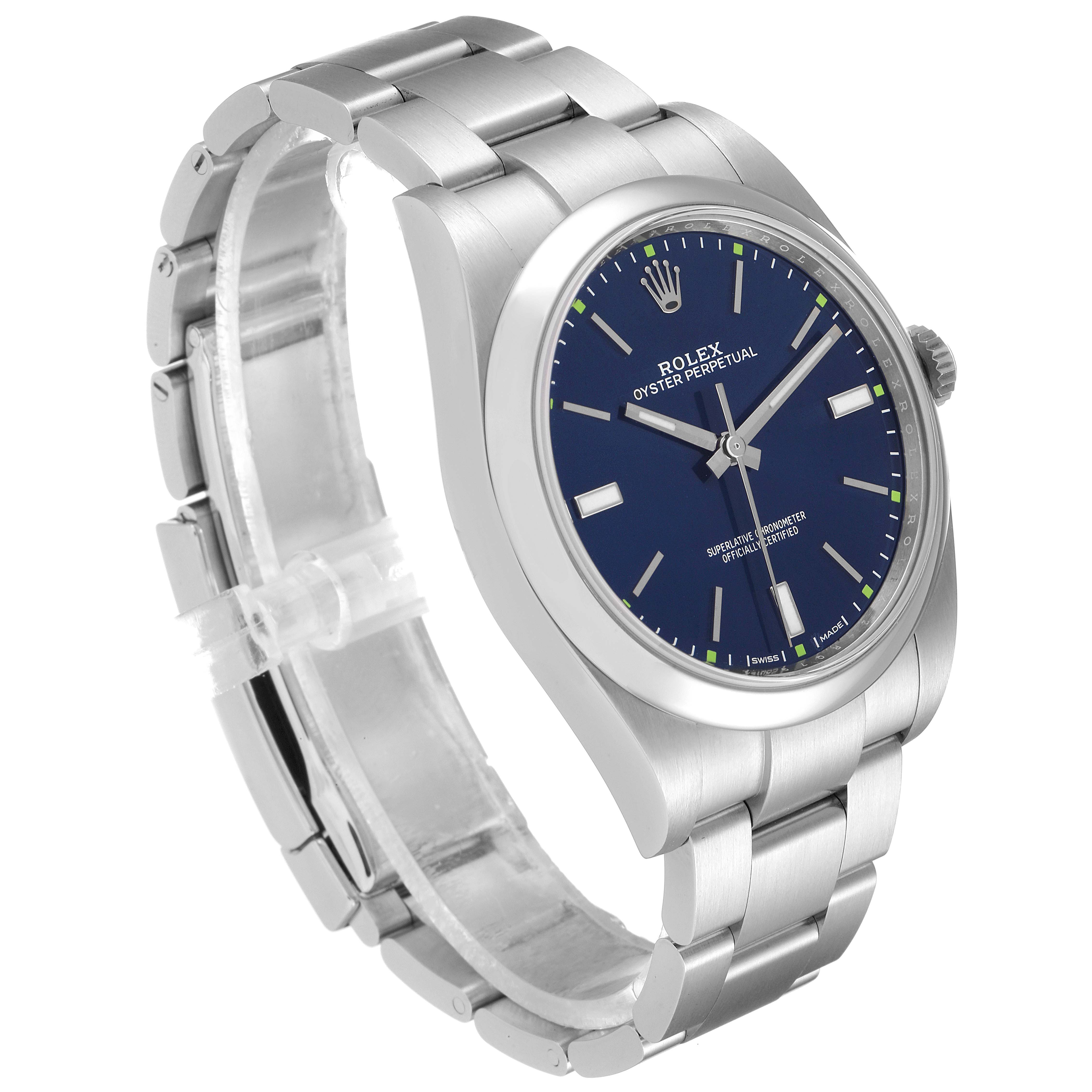 The image shows a Rolex Oyster Perpetual 114300 Men
s Stainless Steel Blue Dial 114300 Men
s Stainless Steel Blue Dial watch at an angled view, highlighting its blue dial, bracelet, and crown.