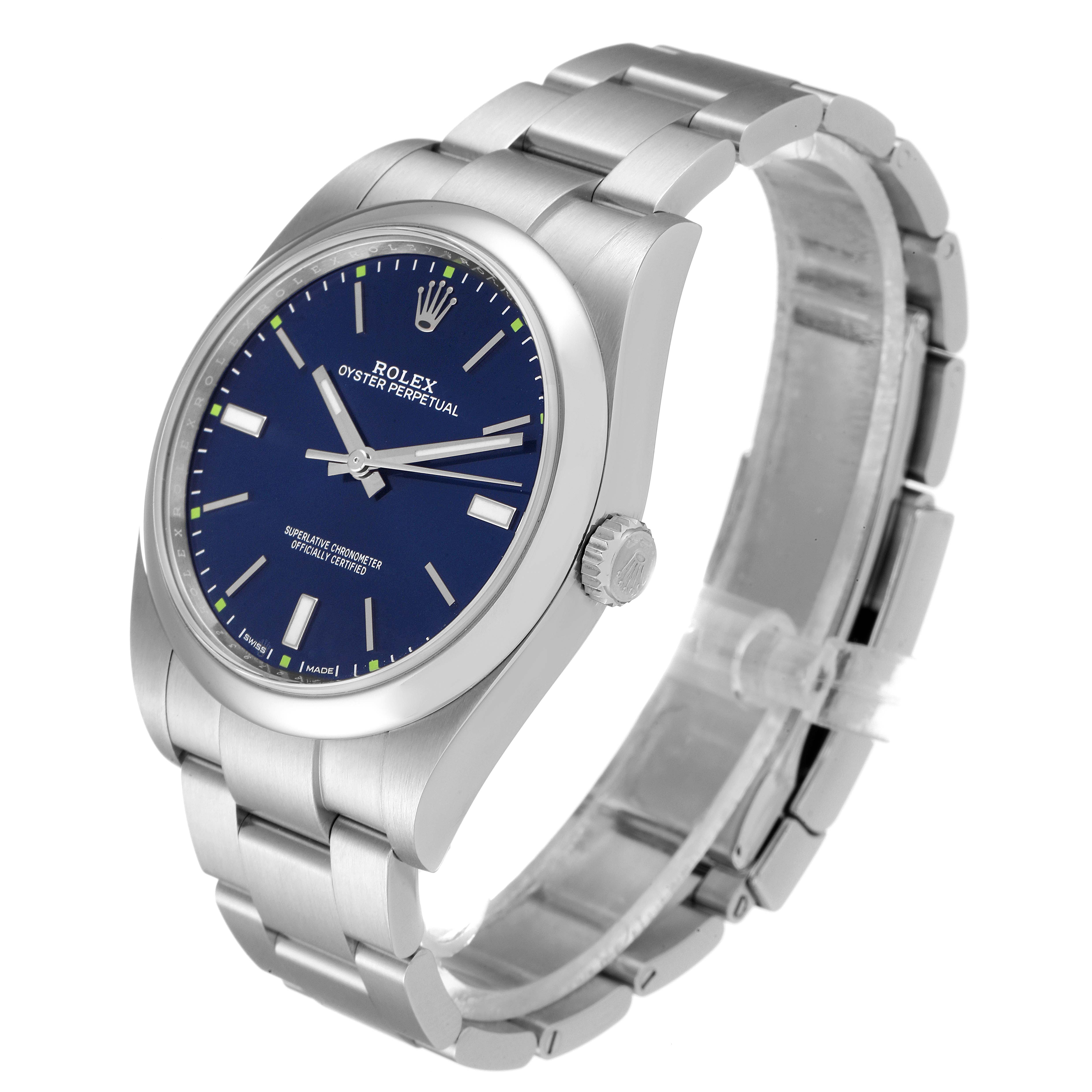 The image displays a Rolex Oyster Perpetual 114300 Men
s Stainless Steel Blue Dial 114300 Men
s Stainless Steel Blue Dial watch at a three-quarter angle, highlighting the bracelet, crown, and blue dial.