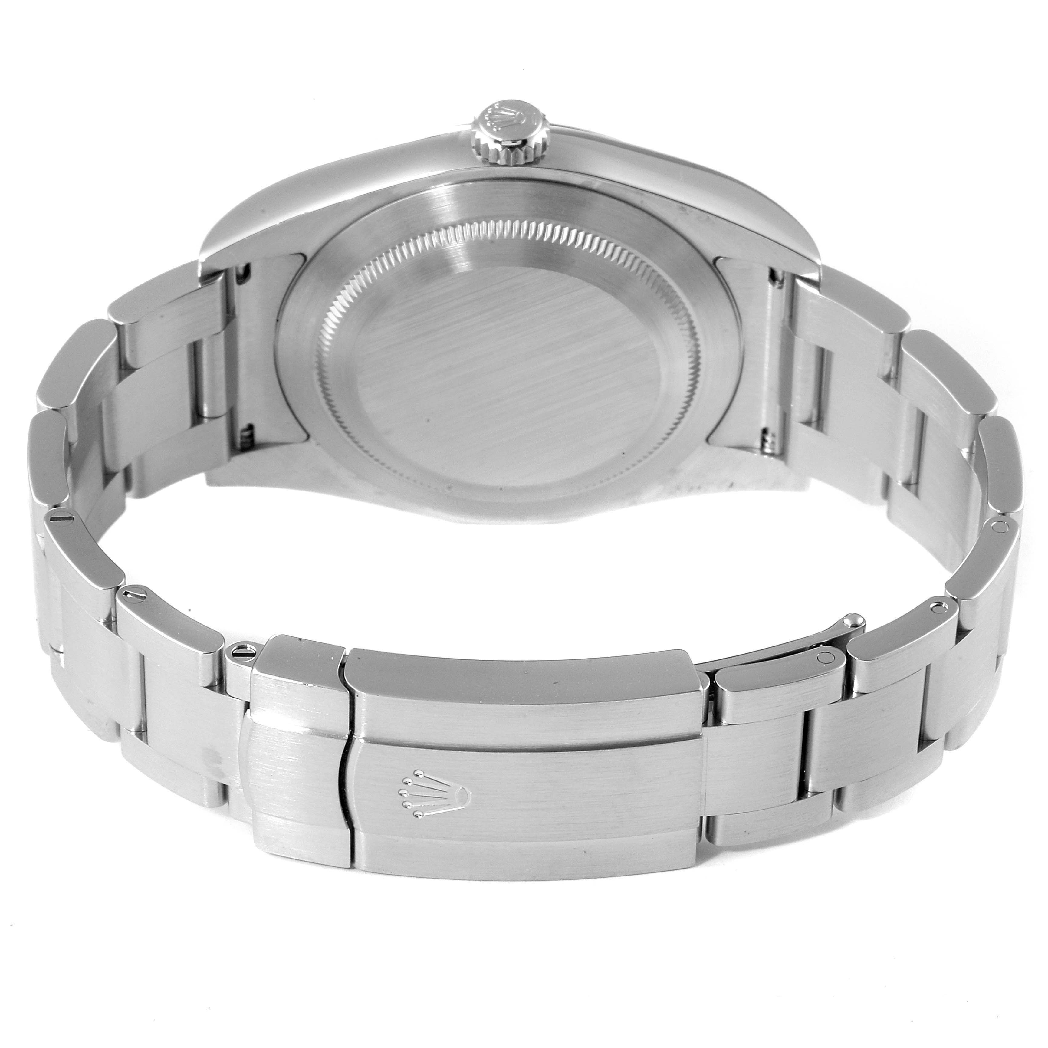 This image shows the back view of a Rolex Oyster Perpetual 114300 Men
s Stainless Steel Blue Dial 114300 Men
s Stainless Steel Blue Dial watch, highlighting the case back and the secured clasp of the bracelet.