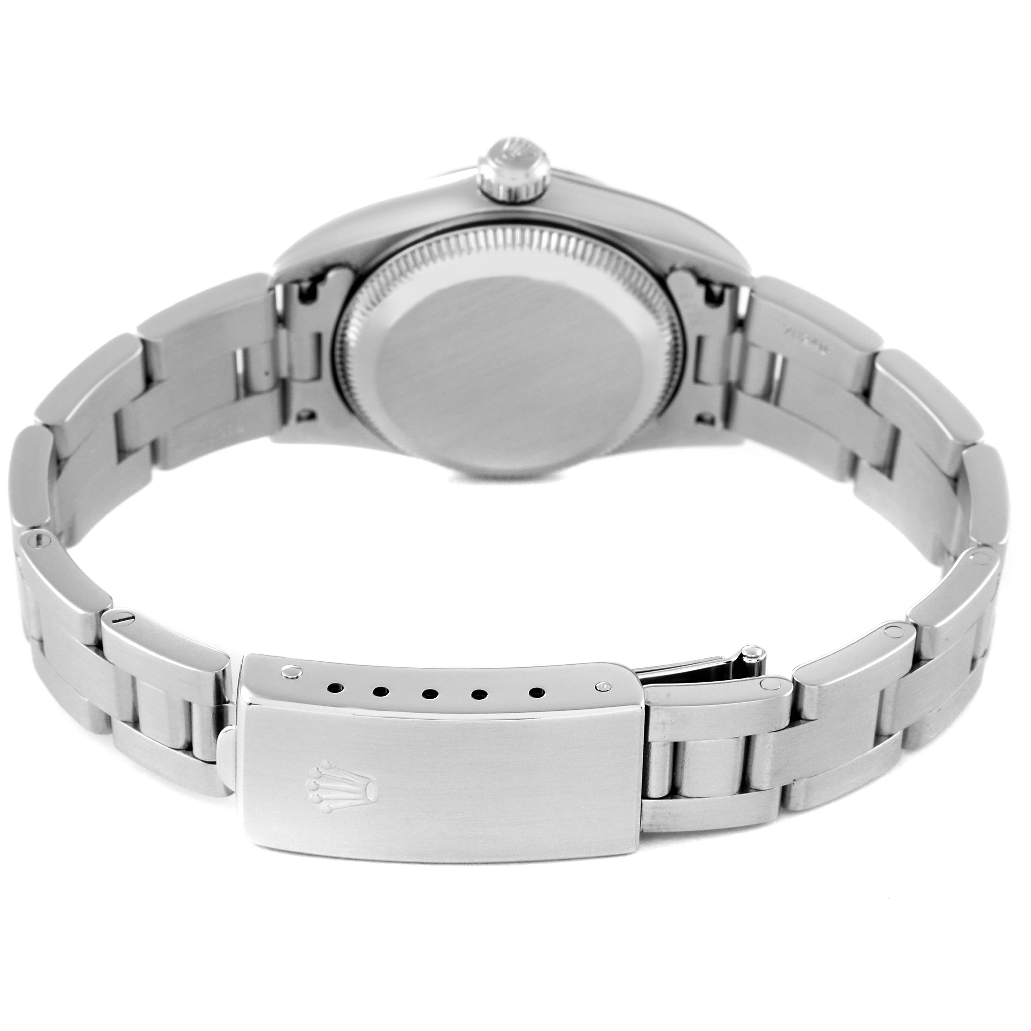 The image shows the back view of a Rolex Oyster Perpetual 76094 Women's Stainless Steel White Dial 76094 Women's Stainless Steel White Dial watch, highlighting its case back and bracelet with clasp.