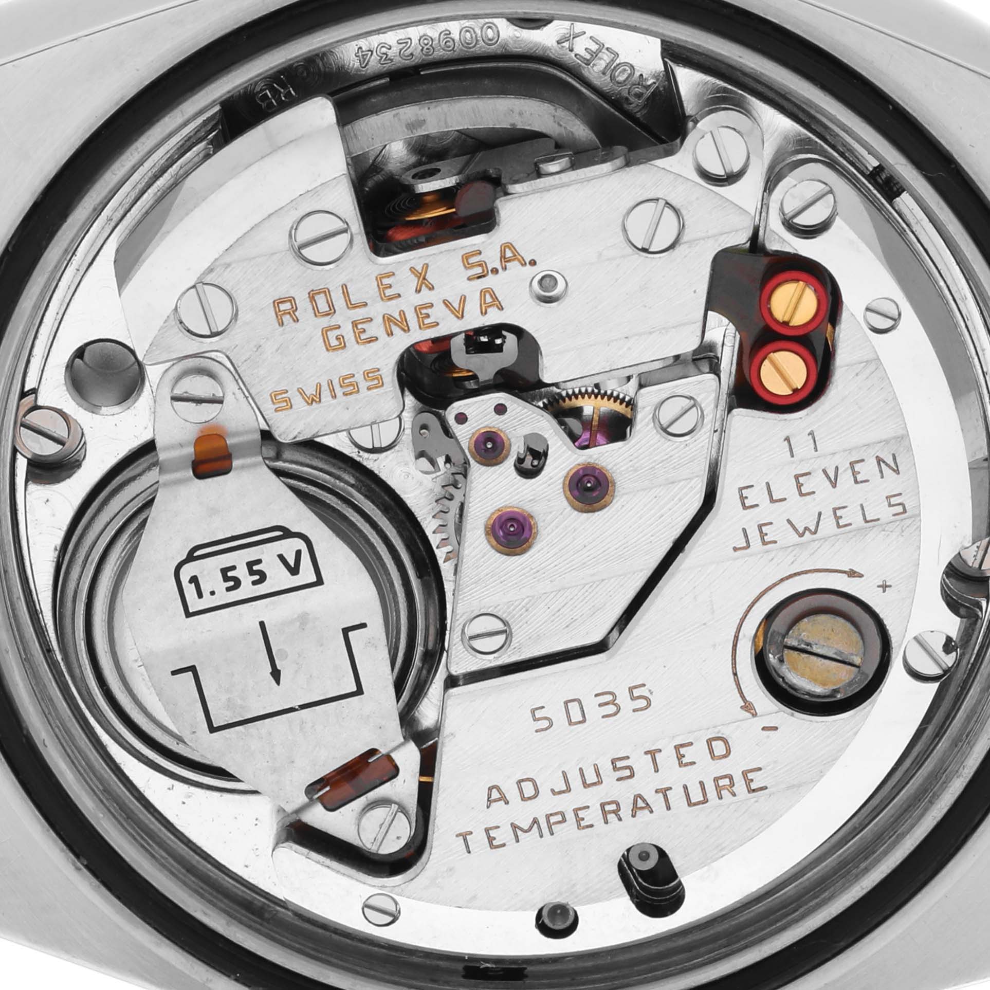 The image shows the movement and internal parts of the Rolex Oysterquartz 17013 Men
s Steel and Gold (two tone) Silver Dial 17013 Men
s Steel and Gold (two tone) Silver Dial watch, highlighting its mechanism and battery.