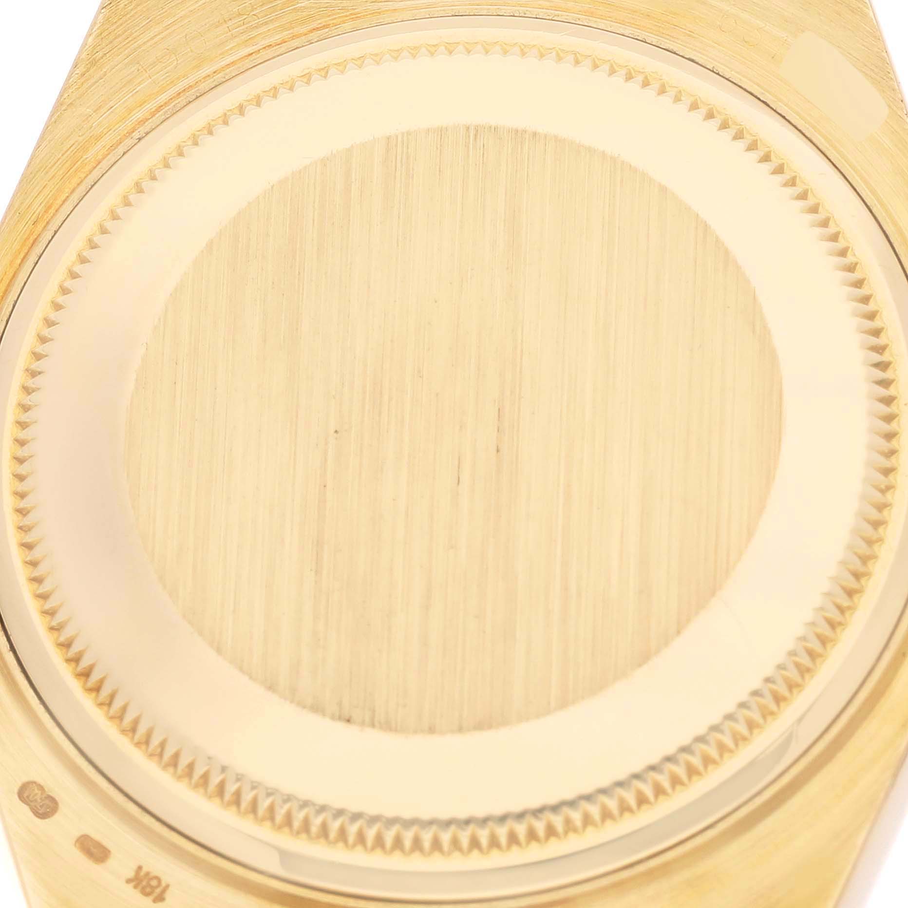 The image shows a close-up of the caseback of a Rolex Oysterquartz 19018 Men
s Yellow Gold Champagne Dial 19018 Men
s Yellow Gold Champagne Dial watch.