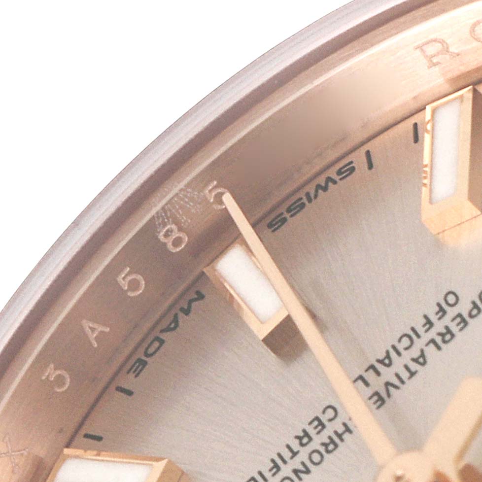 This close-up image of the Rolex President 279175 Women's Rose Gold Pink Dial 279175 Women's Rose Gold Pink Dial model watch shows a portion of the dial, markers, and hands.