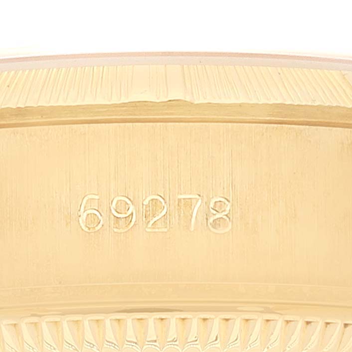 This image shows a close-up of the serial number engraved on the case of a Rolex President 69278 Women
s Yellow Gold White Dial 69278 Women
s Yellow Gold White Dial model watch.