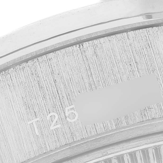 The image shows a close-up of the Rolex President 69089 Women's White Gold Mother of Pearl Dial 69089 Women's White Gold Mother of Pearl Dial watch bezel from the side.