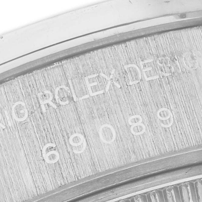 The image shows a close-up of the engraved details on the case back of a Rolex President 69089 Women's White Gold Mother of Pearl Dial 69089 Women's White Gold Mother of Pearl Dial model.