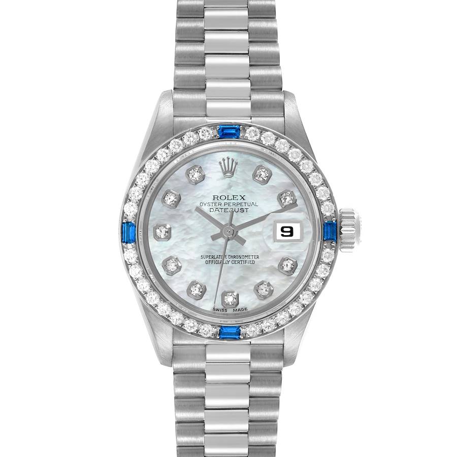 The Rolex President model is shown from a top-down angle, featuring the face, bezel, and bracelet.