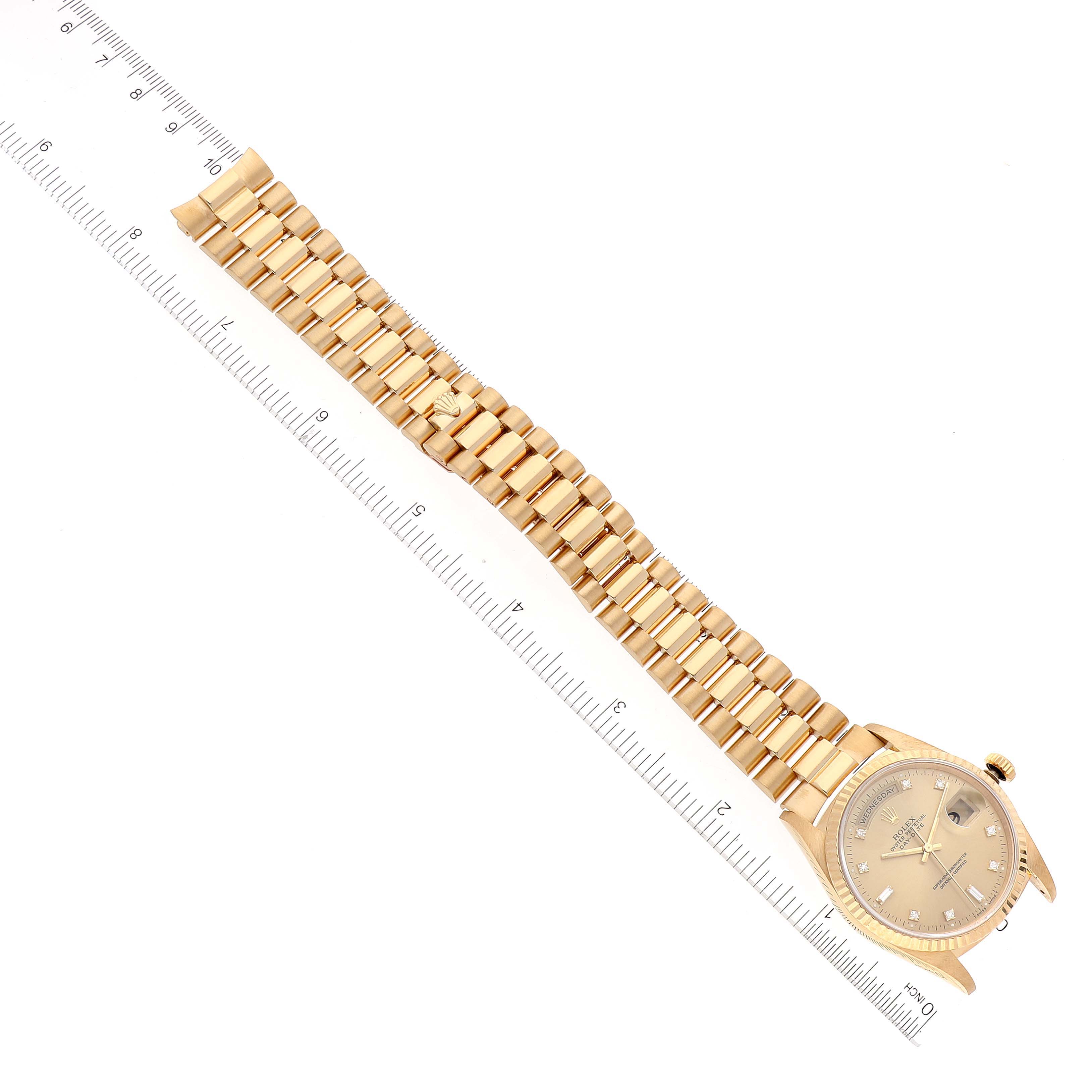 The image shows a Rolex President 18238 Men
s Yellow Gold Champagne Dial 18238 Men
s Yellow Gold Champagne Dial model watch laid flat, highlighting the entire bracelet and dial at an angle.
