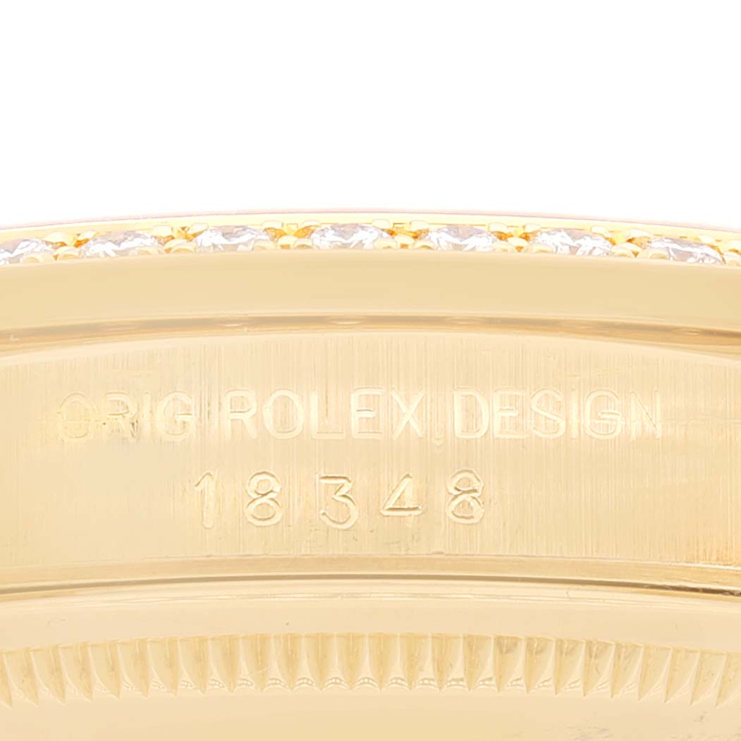 This close-up shows the engraved bezel and model number "18348" of the Rolex President 18348 Men's Yellow Gold Champagne Dial 18348 Men's Yellow Gold Champagne Dial watch.