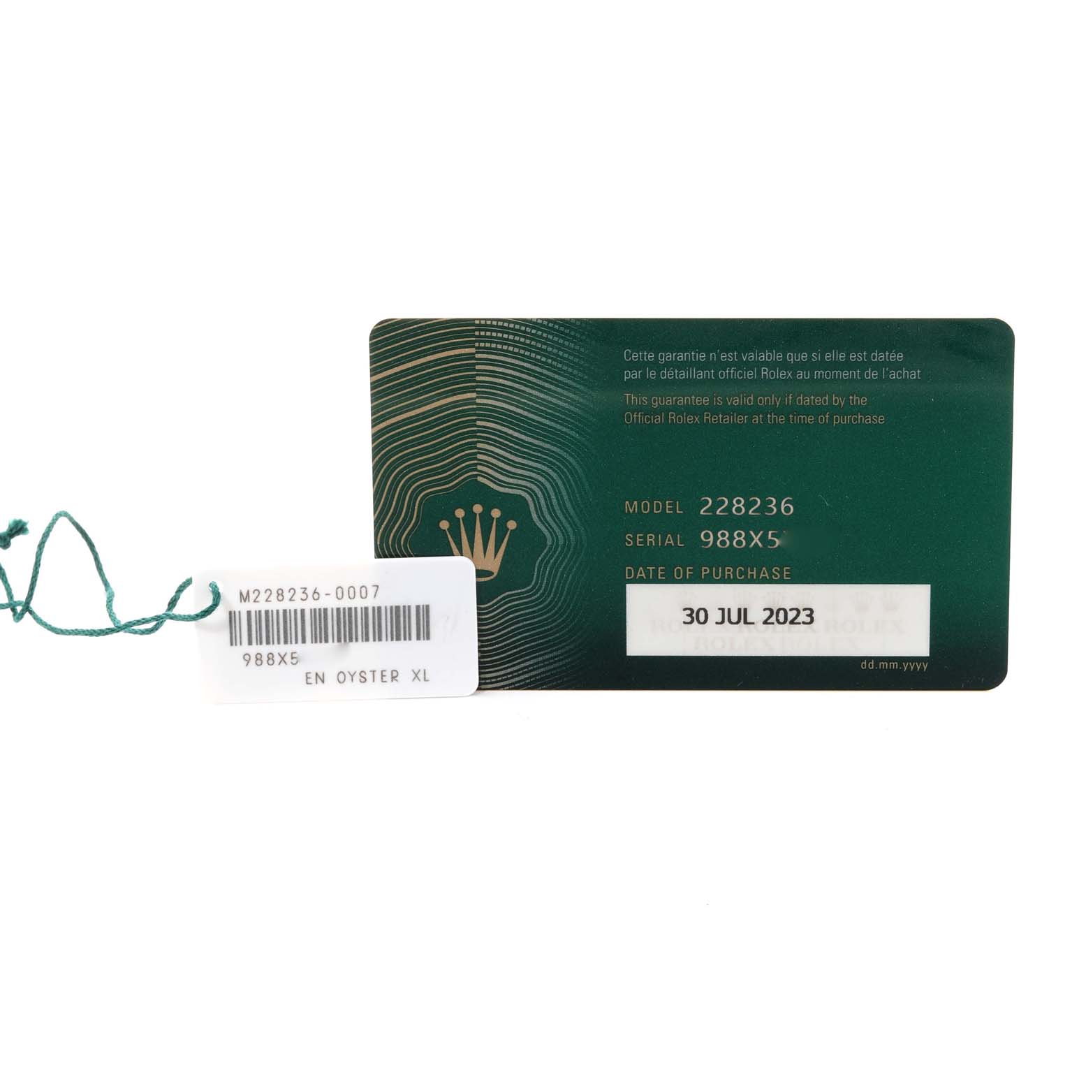 This image shows a Rolex President 228236 Men's Platinum Blue Dial 228236 Men's Platinum Blue Dial model guarantee card and tag with model and serial numbers visible.