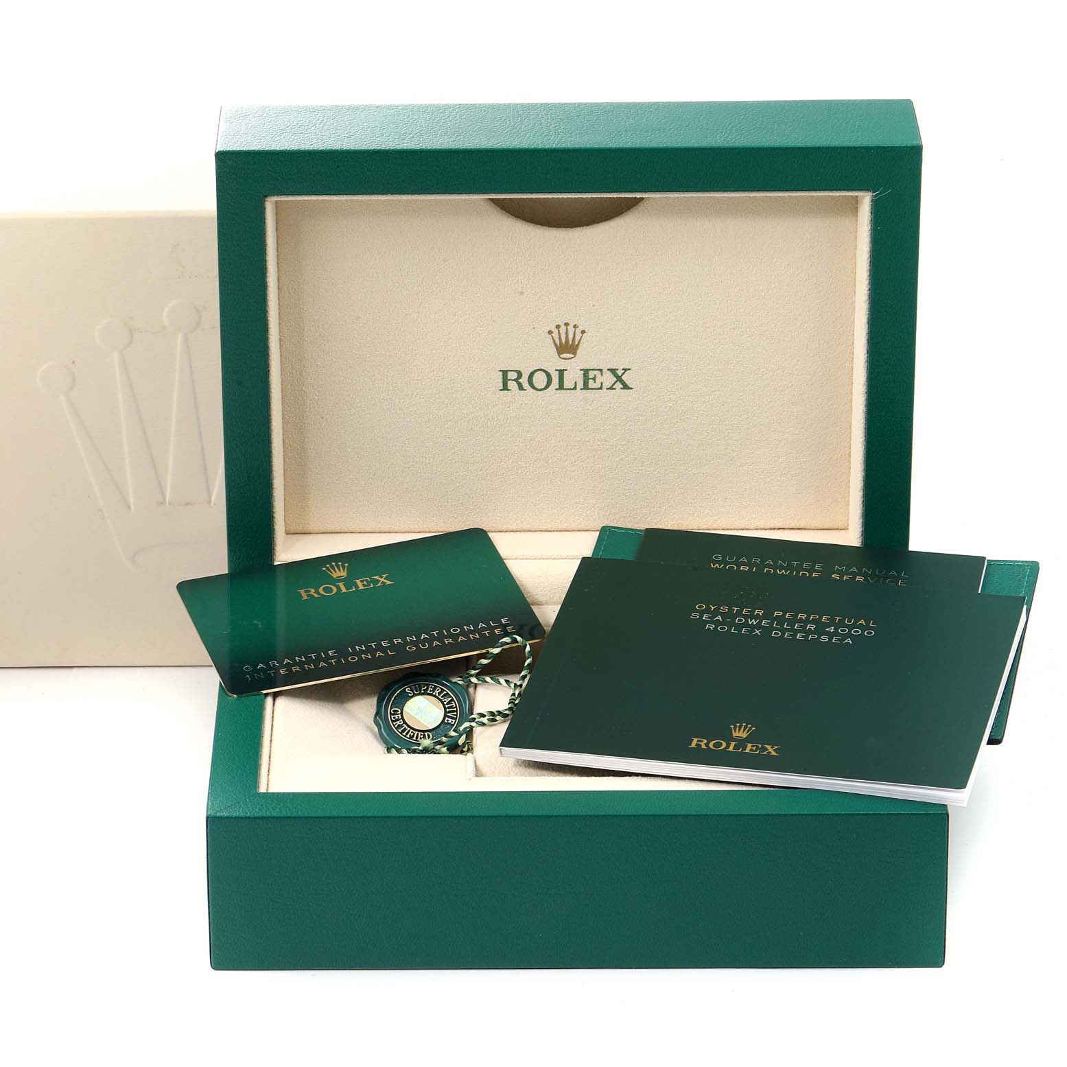 The image shows the packaging of a Rolex Sea-Dweller 126660 Men
s Stainless Steel Blue Dial 126660 Men
s Stainless Steel Blue Dial watch model, including booklets, warranty card, and tags inside a green box.