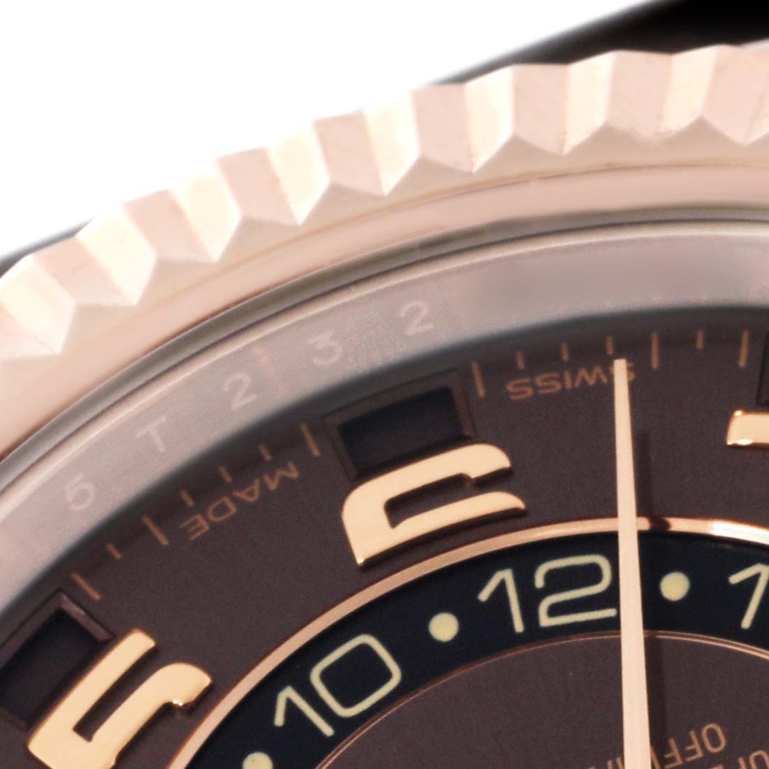 The image shows a close-up view of the dial and fluted bezel of the Rolex Sky-Dweller 326135 Men's Rose Gold Brown Dial 326135 Men's Rose Gold Brown Dial watch.