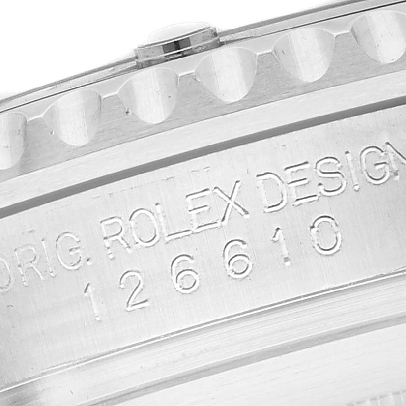 This close-up image shows the engraved model number and part of the bezel of the Rolex Submariner 126610 Men
s Stainless Steel Black Dial 126610 Men
s Stainless Steel Black Dial.