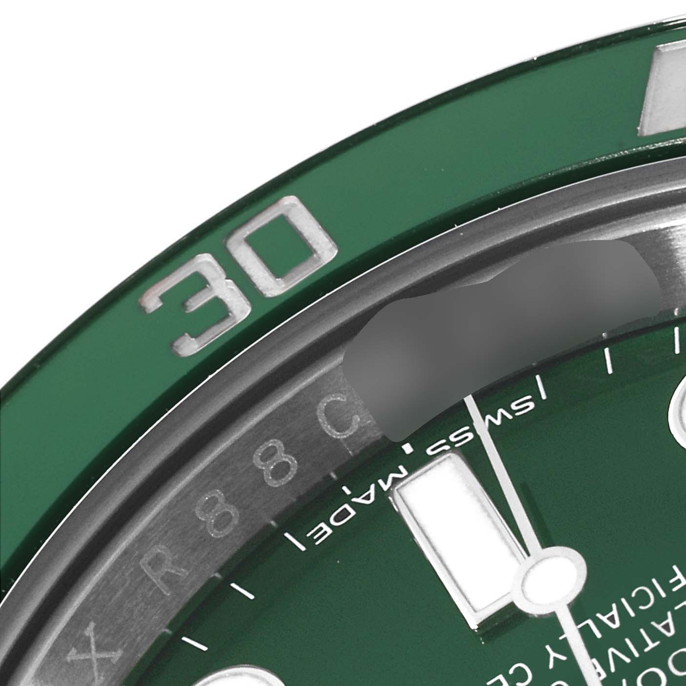 This close-up image of a Rolex Submariner 116610LV Men's Stainless Steel Green Dial 116610LV Men's Stainless Steel Green Dial watch shows the bezel with the 30-minute marker and part of the dial with "Swiss Made."