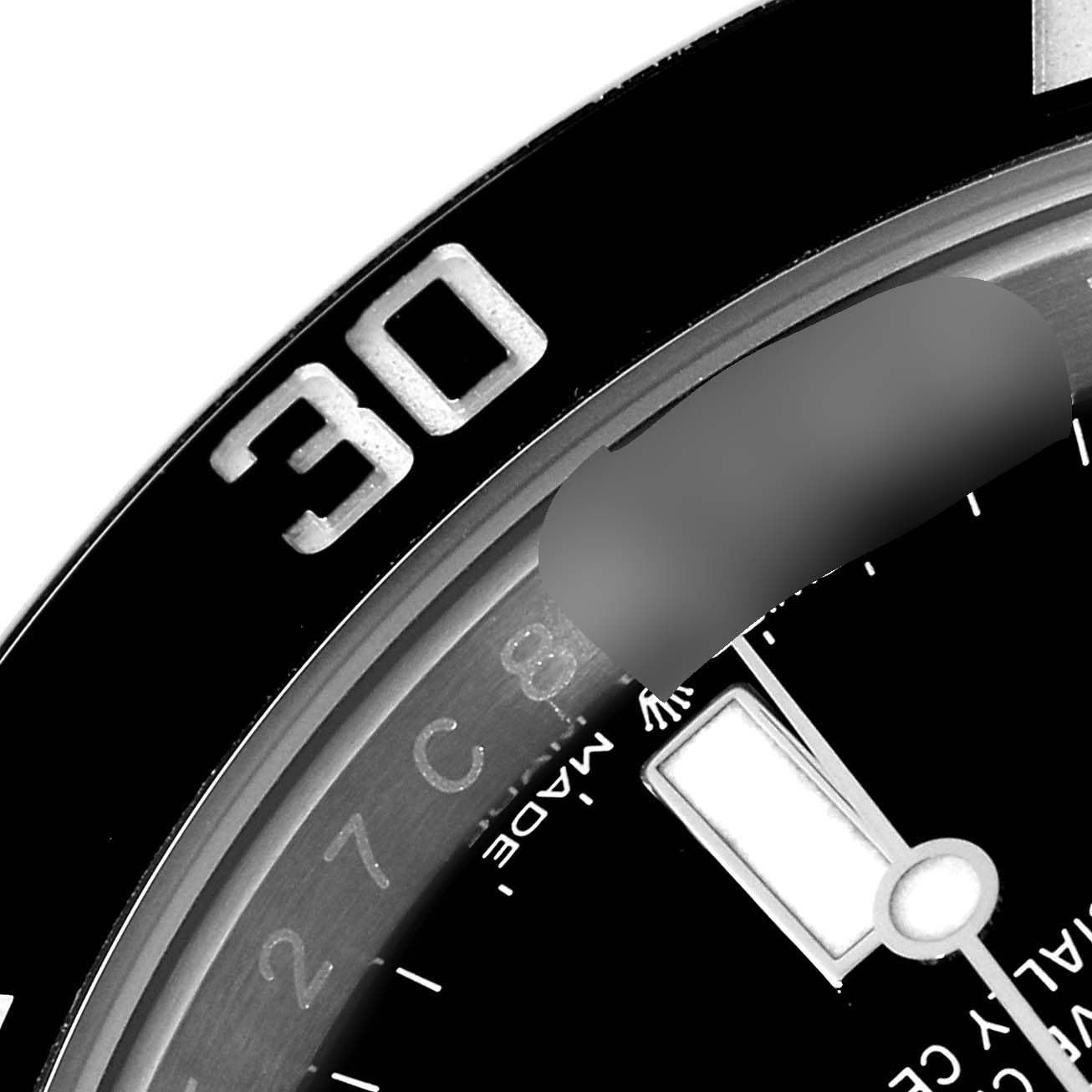 The image shows a close-up of the bezel and a portion of the dial and hand of a Rolex Submariner 124060 Men's Stainless Steel Black Dial 124060 Men's Stainless Steel Black Dial watch.
