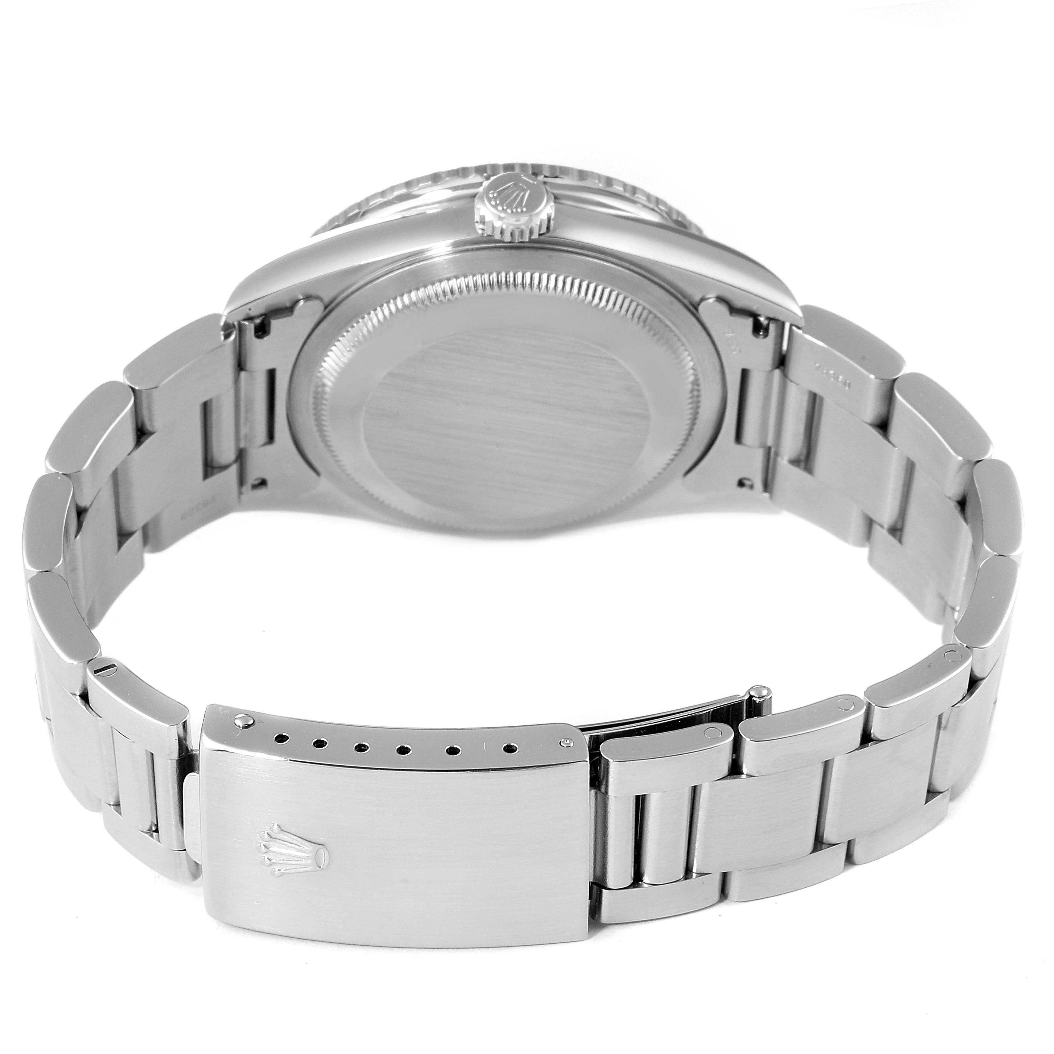 The image shows the back and side view of a Rolex Turn-o-Graph 16264 Men
s Stainless Steel Silver Dial 16264 Men
s Stainless Steel Silver Dial watch, focusing on its clasp, bracelet, and case back.