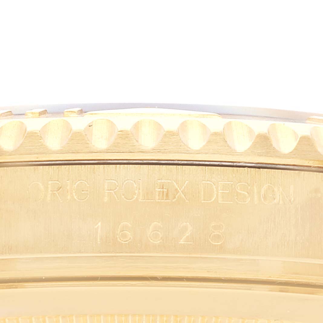 This close-up image shows the side view of the bezel and case of a Rolex Yacht-Master 16628 Men's Yellow Gold Blue Dial 16628 Men's Yellow Gold Blue Dial watch.