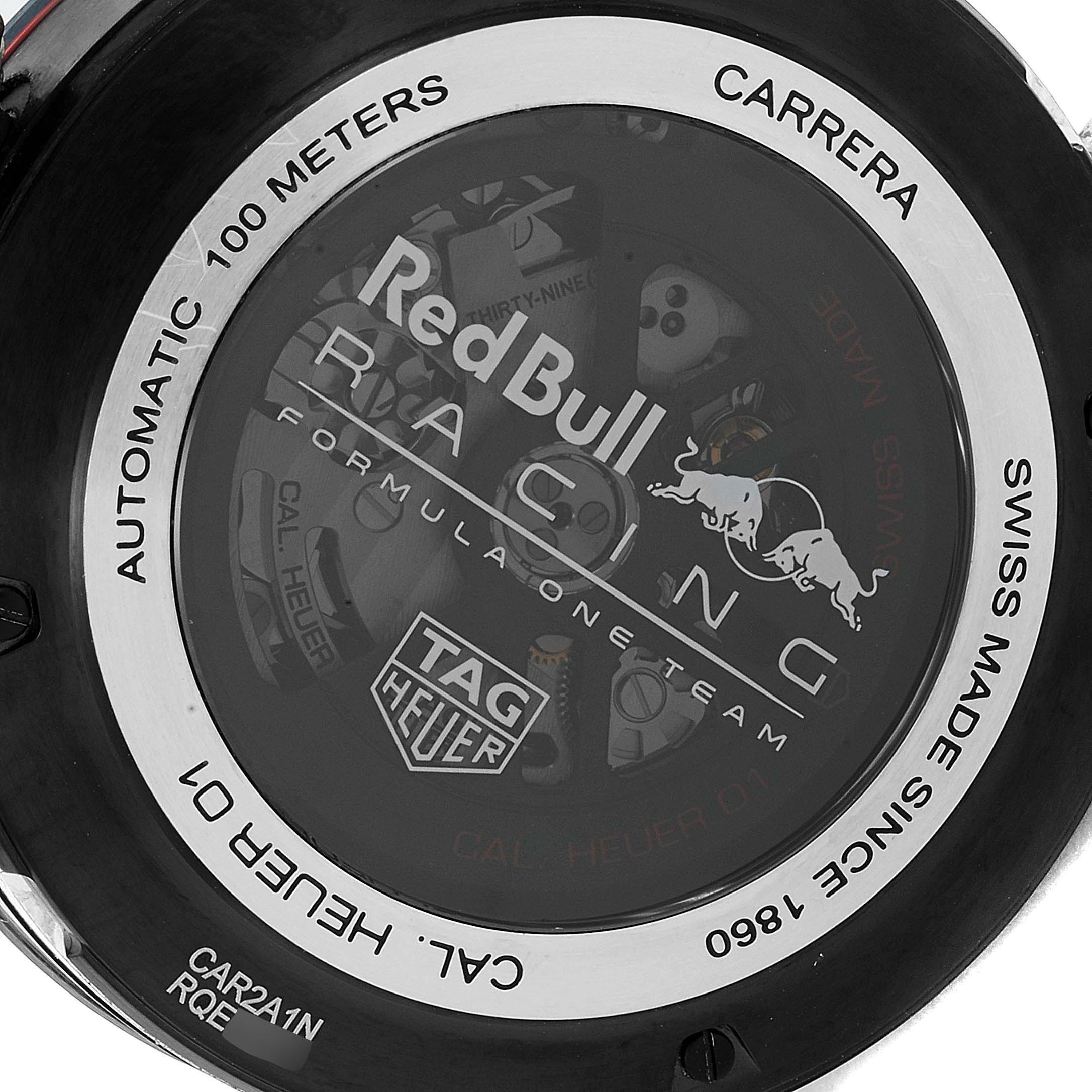 The image shows the transparent case back of a Tag Heuer Carrera CAR2A1N.FT6100 Men's Stainless Steel Blue Dial CAR2A1N.FT6100 Men's Stainless Steel Blue Dial watch, displaying the movement and Red Bull Racing branding.