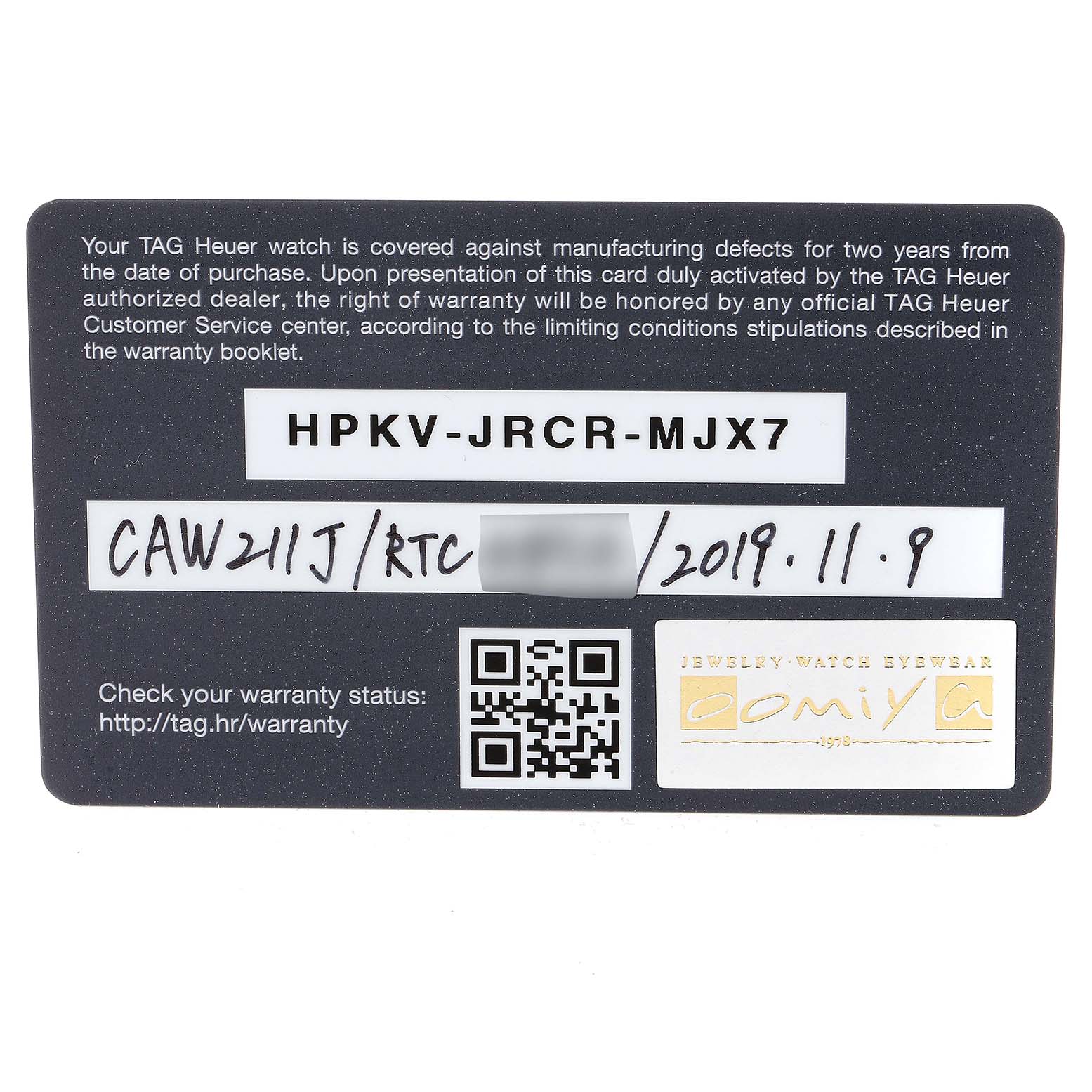 The image shows a warranty card for a Tag Heuer Monaco model watch, displaying warranty details and a QR code.