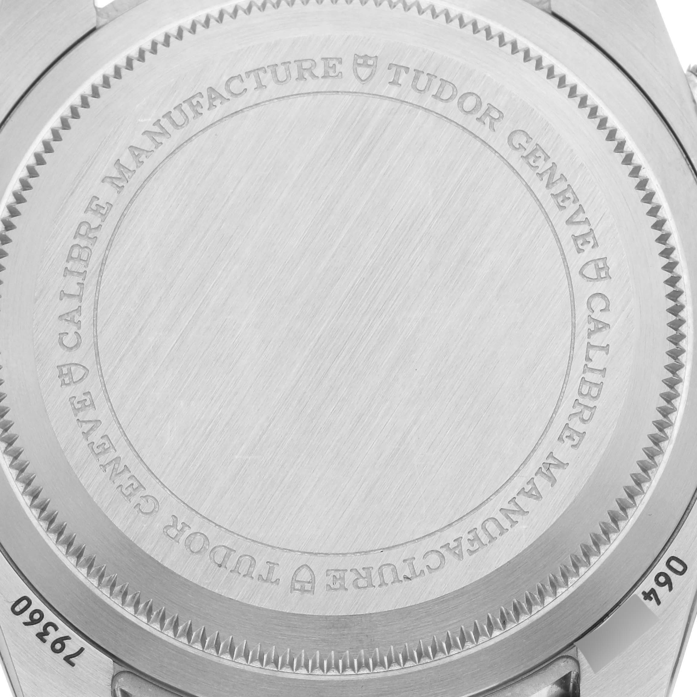 The image shows the back case of a Tudor Heritage Chrono M79360N-002 Men
s Stainless Steel Silver Dial M79360N-002 Men
s Stainless Steel Silver Dial watch, focusing on its engravings and texture.