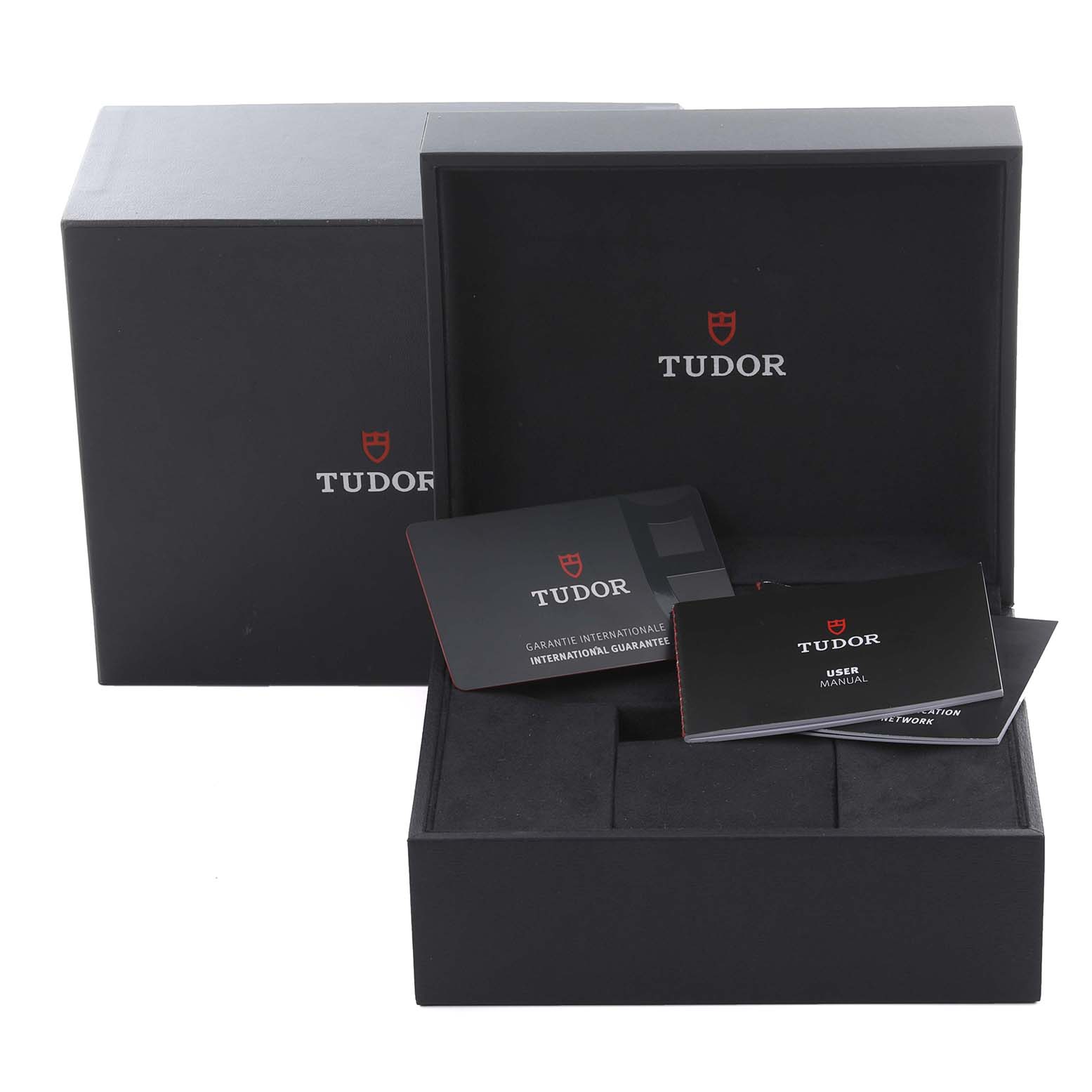 The image shows the Tudor Heritage Chrono M79360N-002 Men
s Stainless Steel Silver Dial M79360N-002 Men
s Stainless Steel Silver Dial
s packaging with the warranty card and user manual inside the open box.