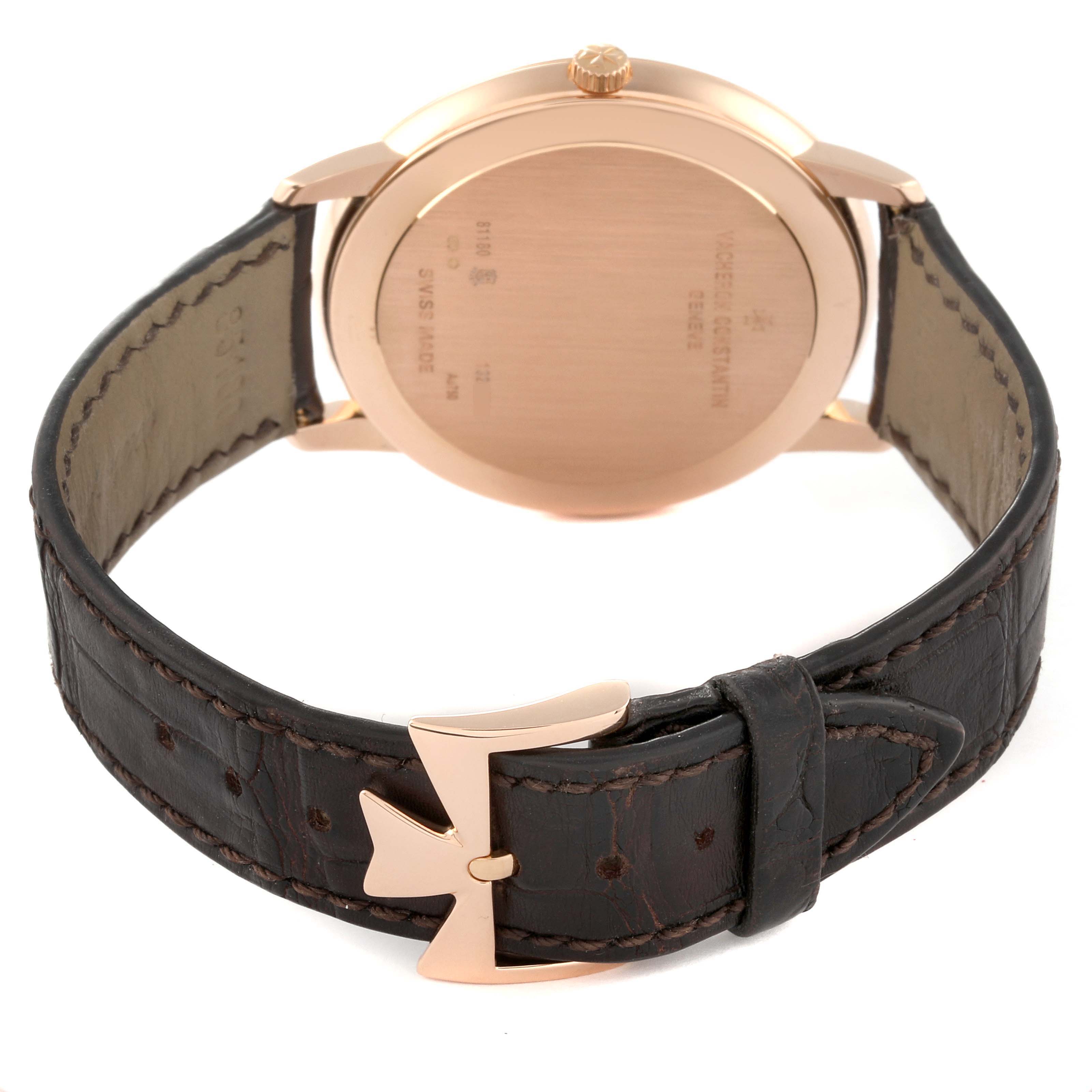 The image shows the back of a Vacheron Constantin Patrimony 81180/000R-9162 Men's Rose Gold Brown Dial 81180/000R-9162 Men's Rose Gold Brown Dial watch, highlighting its case back, crown, and leather strap with a unique buckle.