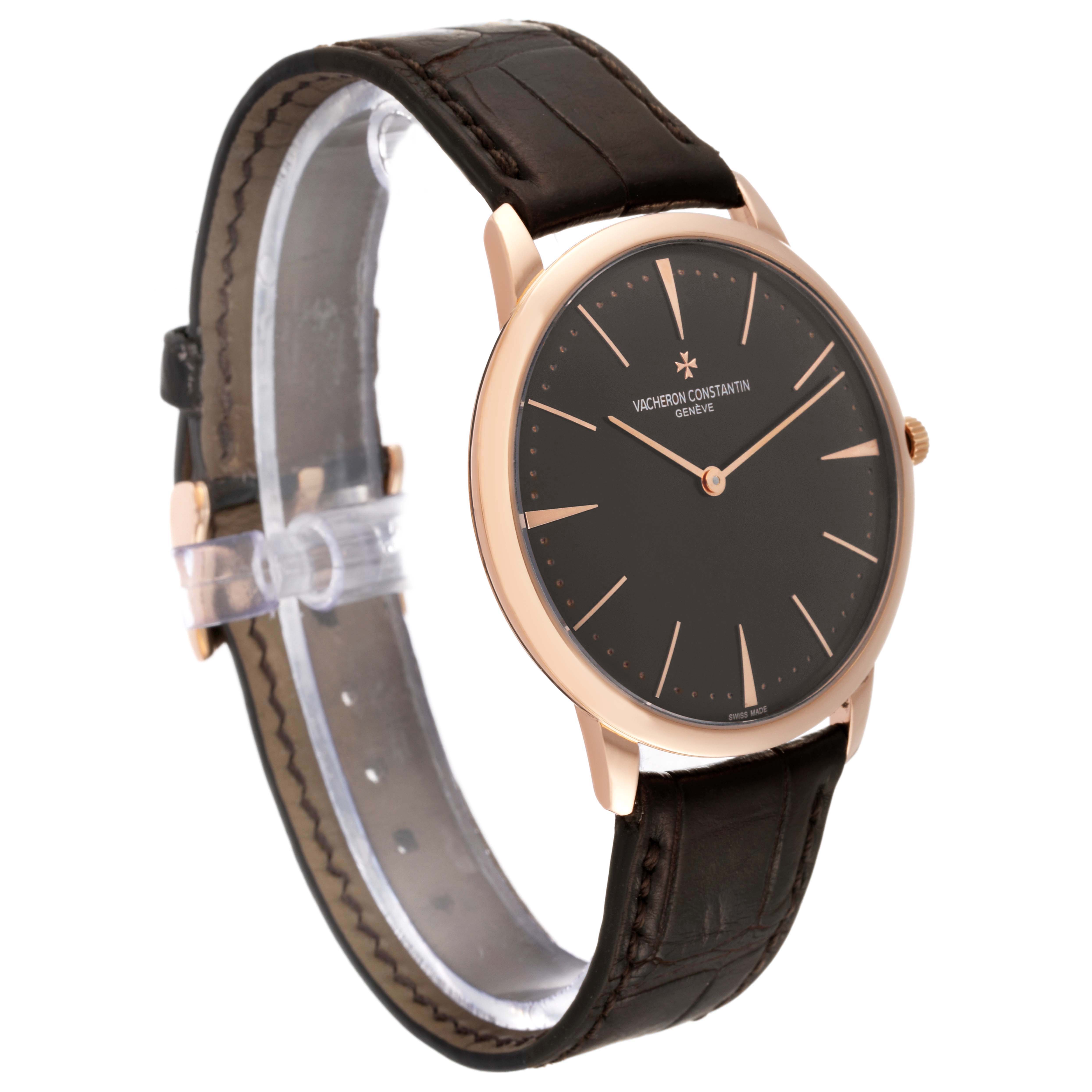 The watch is shown at a side angle, highlighting the face, strap, and crown of the Vacheron Constantin Patrimony 81180/000R Men's Rose Gold Brown Dial.