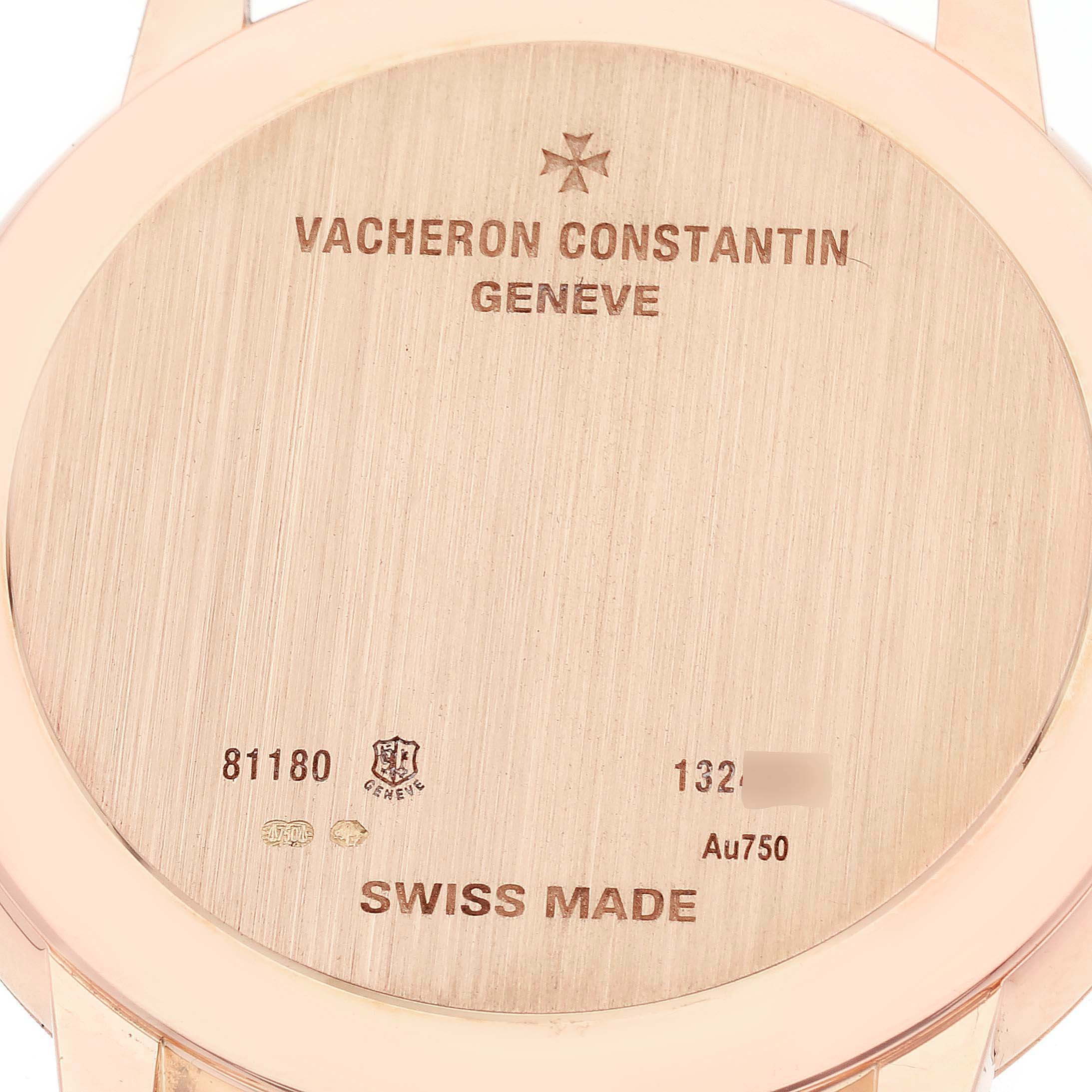 The image shows the back of a Vacheron Constantin Patrimony 81180/000R-9283 Men's Rose Gold Brown Dial watch, featuring engravings and material details.