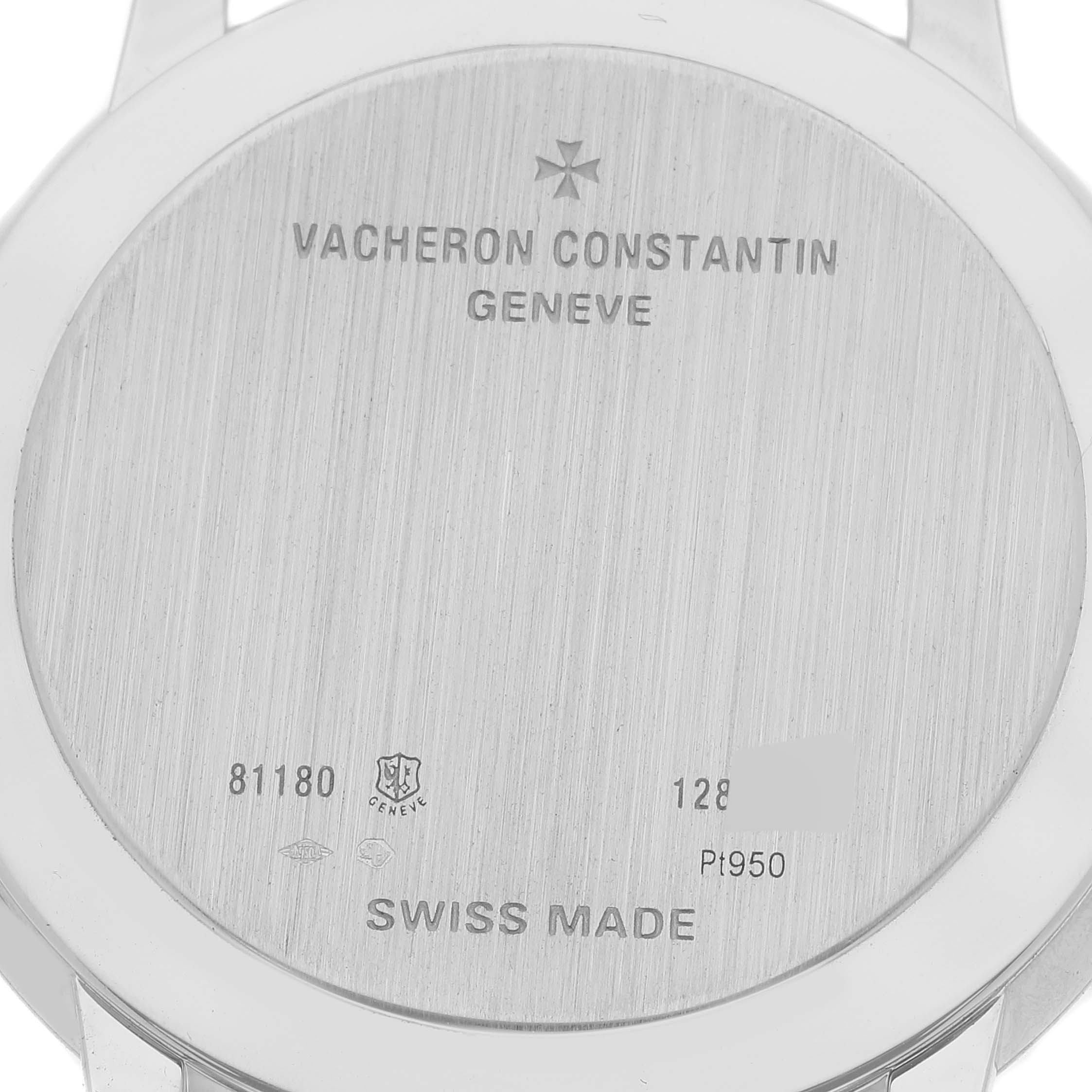 The image shows the back case of a Vacheron Constantin Patrimony 81180 Men's Platinum Grey Dial 81180 Men's Platinum Grey Dial watch, displaying engravings and model information.