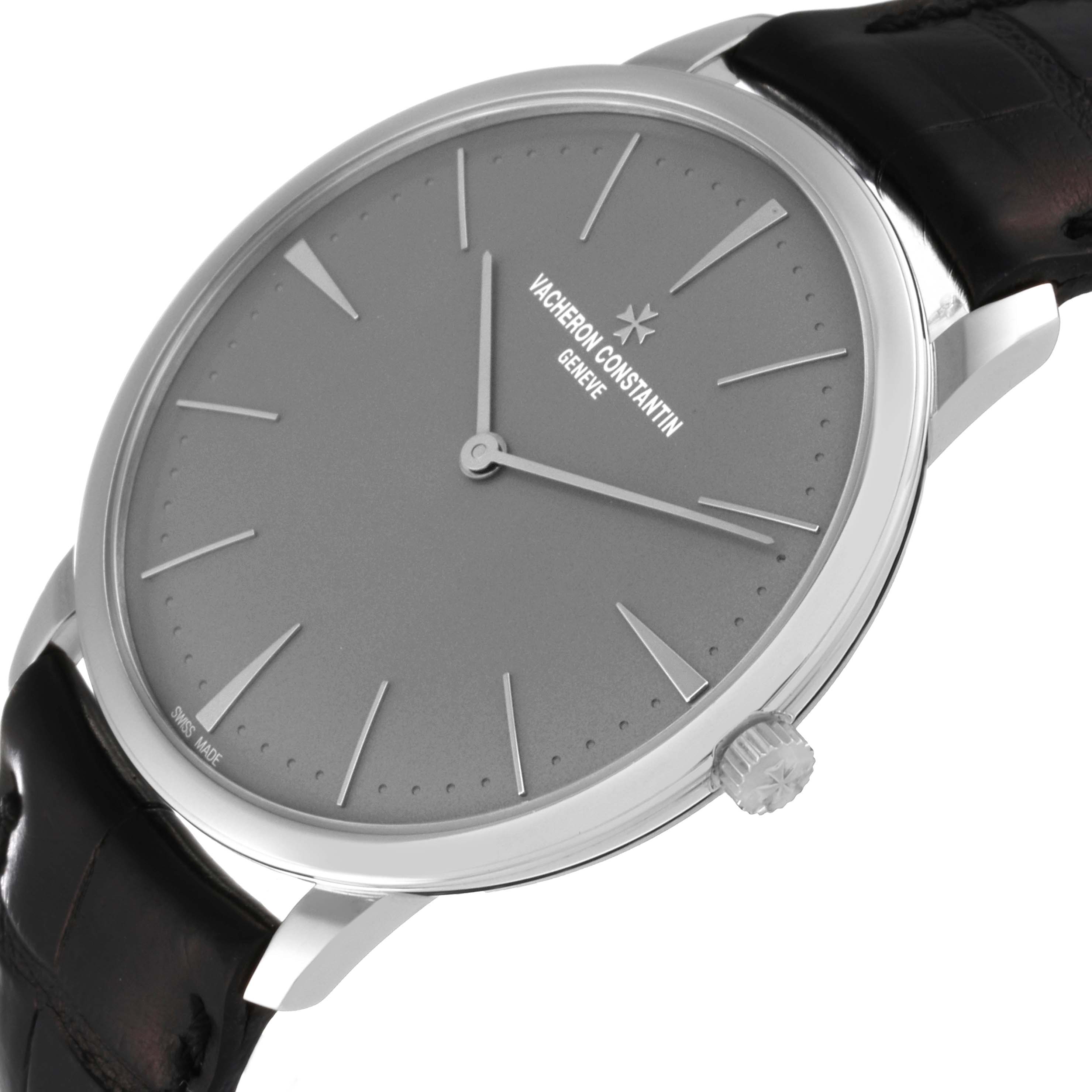 The image shows the Vacheron Constantin Patrimony 81180 Men's Platinum Grey Dial 81180 Men's Platinum Grey Dial watch at an angled side view, displaying the watch face, crown, and part of the strap.