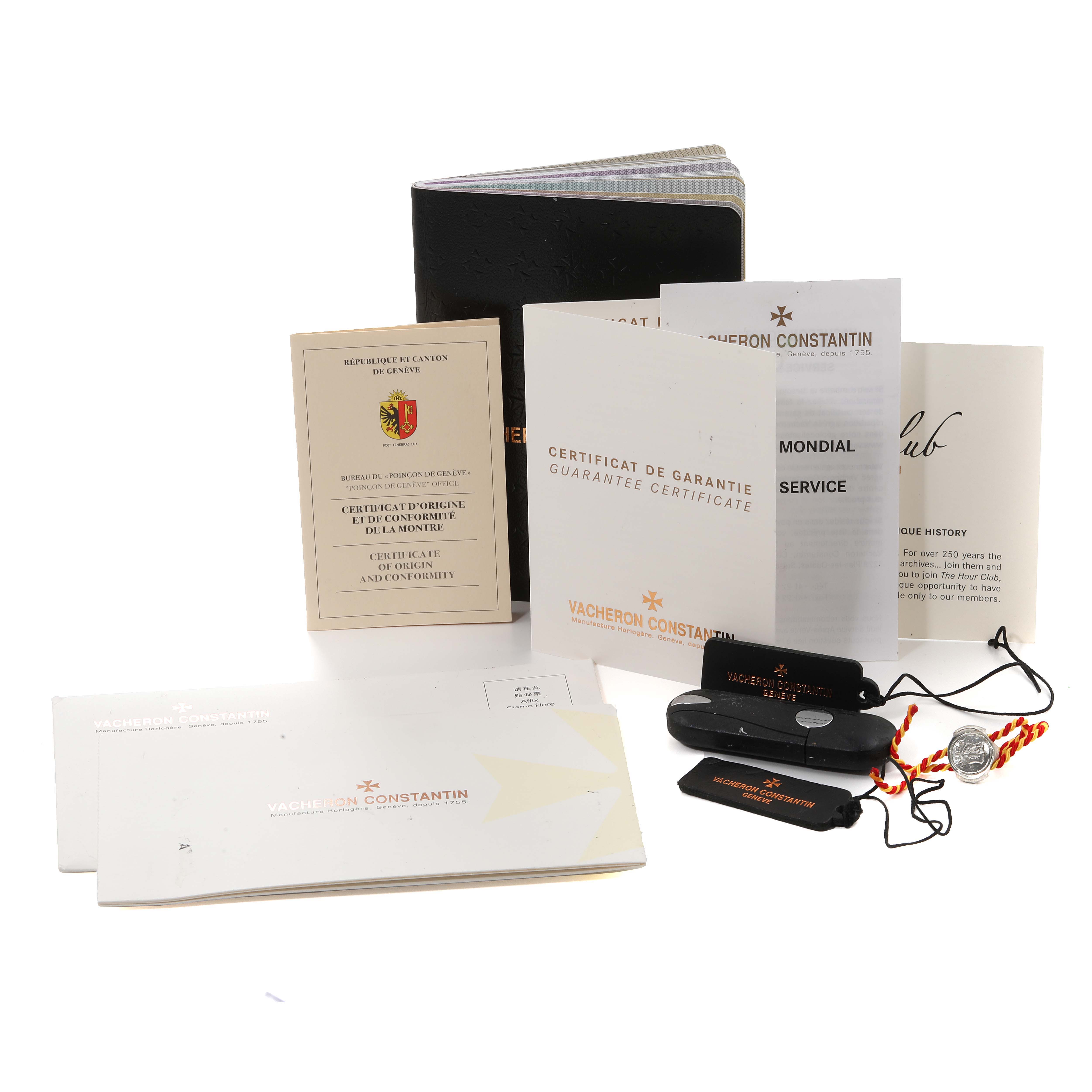 The image shows the Patrimony model by Vacheron Constantin with its box, booklets, certificates, tags, and accessories.