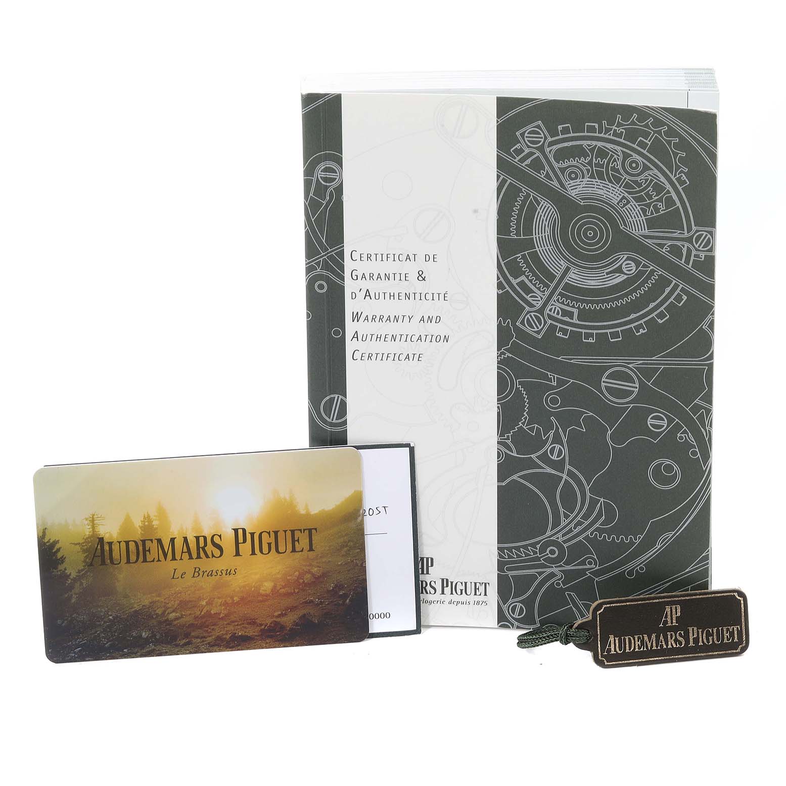 The image shows the warranty, authentication certificate, and tags for the Royal Oak model by Audemars Piguet.