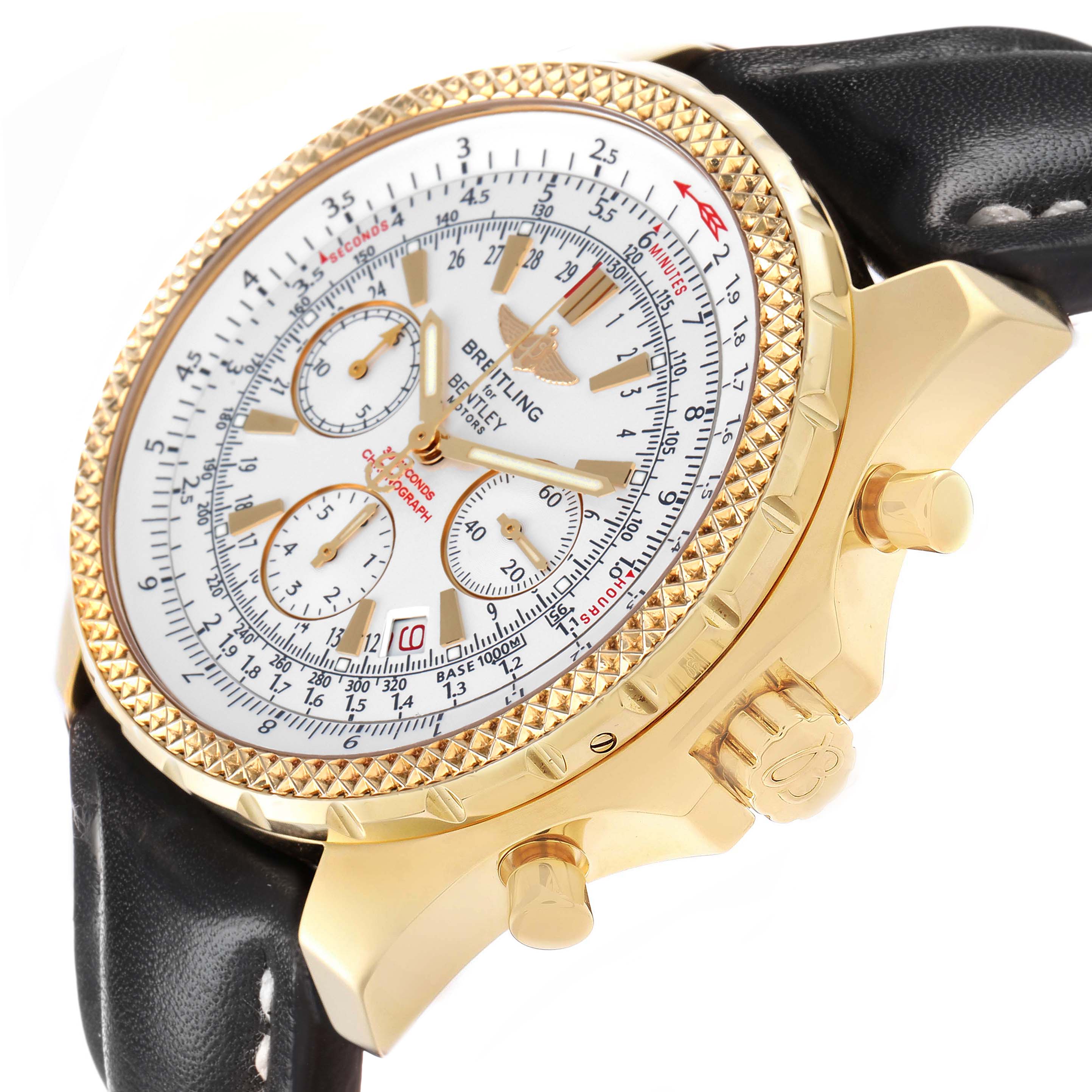 The Breitling Bentley K25362 Men's Yellow Gold White Dial watch is shown at a three-quarter angle, displaying the dial, crown, pushers, and partial leather strap.