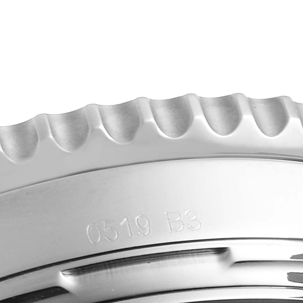 This close-up shot of the Breitling Navitimer AB0121 Men
s Stainless Steel Black Dial AB0121 Men
s Stainless Steel Black Dial watch shows a segment of the bezel with its distinctive ridges.