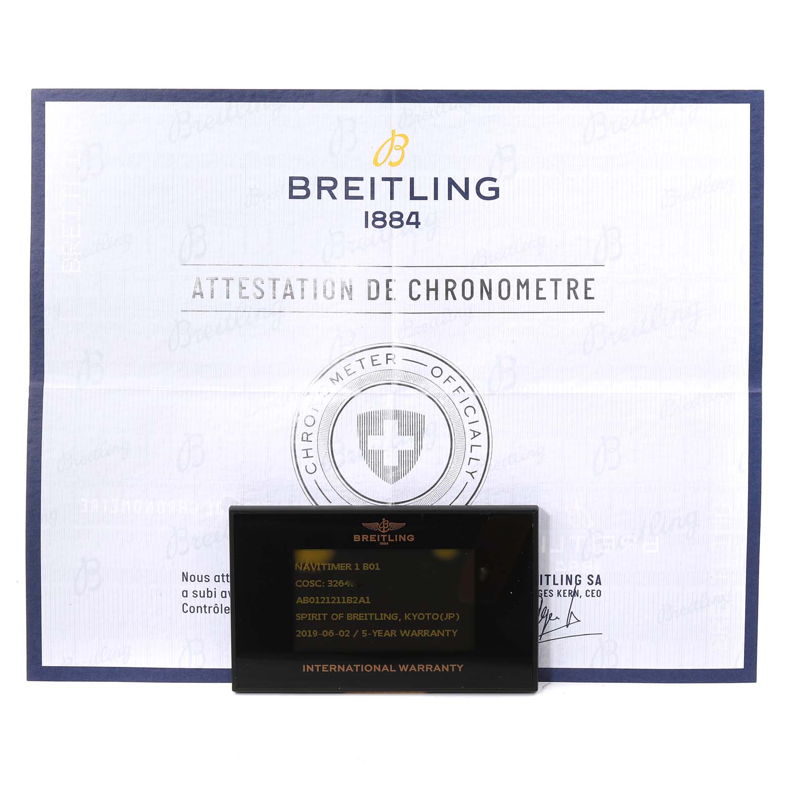 This image shows a Breitling Navitimer AB0121 Men
s Stainless Steel Black Dial AB0121 Men
s Stainless Steel Black Dial model international warranty card alongside the official chronometer attestation certificate.