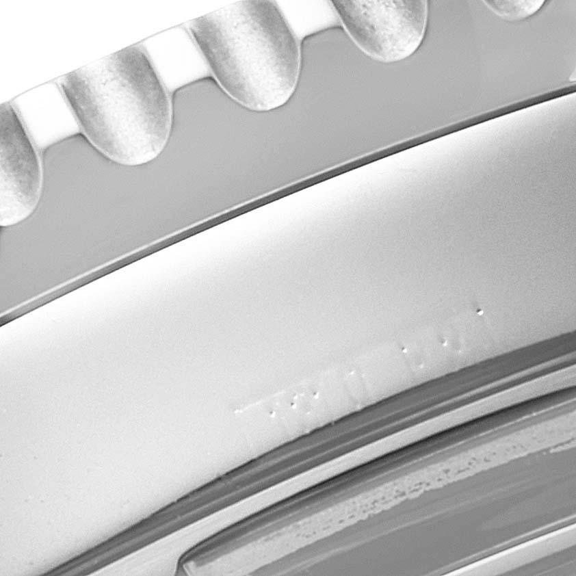 The image shows a close-up of the edge and bezel of a Breitling Navitimer A23322 Men's Stainless Steel Black Dial A23322 Men's Stainless Steel Black Dial watch.