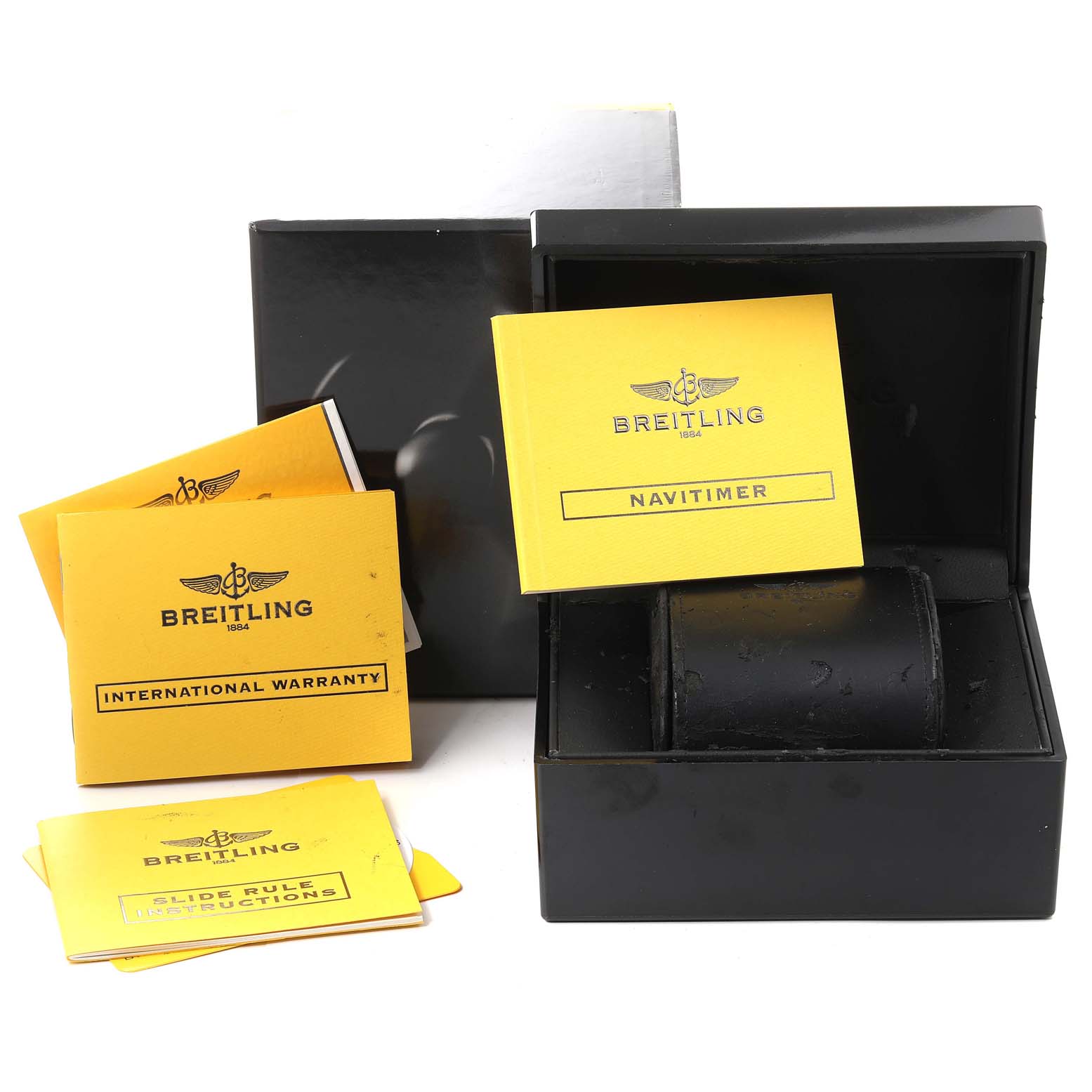 This image shows the box and booklets for a Breitling Navitimer A23322 Men's Stainless Steel Black Dial A23322 Men's Stainless Steel Black Dial watch, including warranty and instructions.