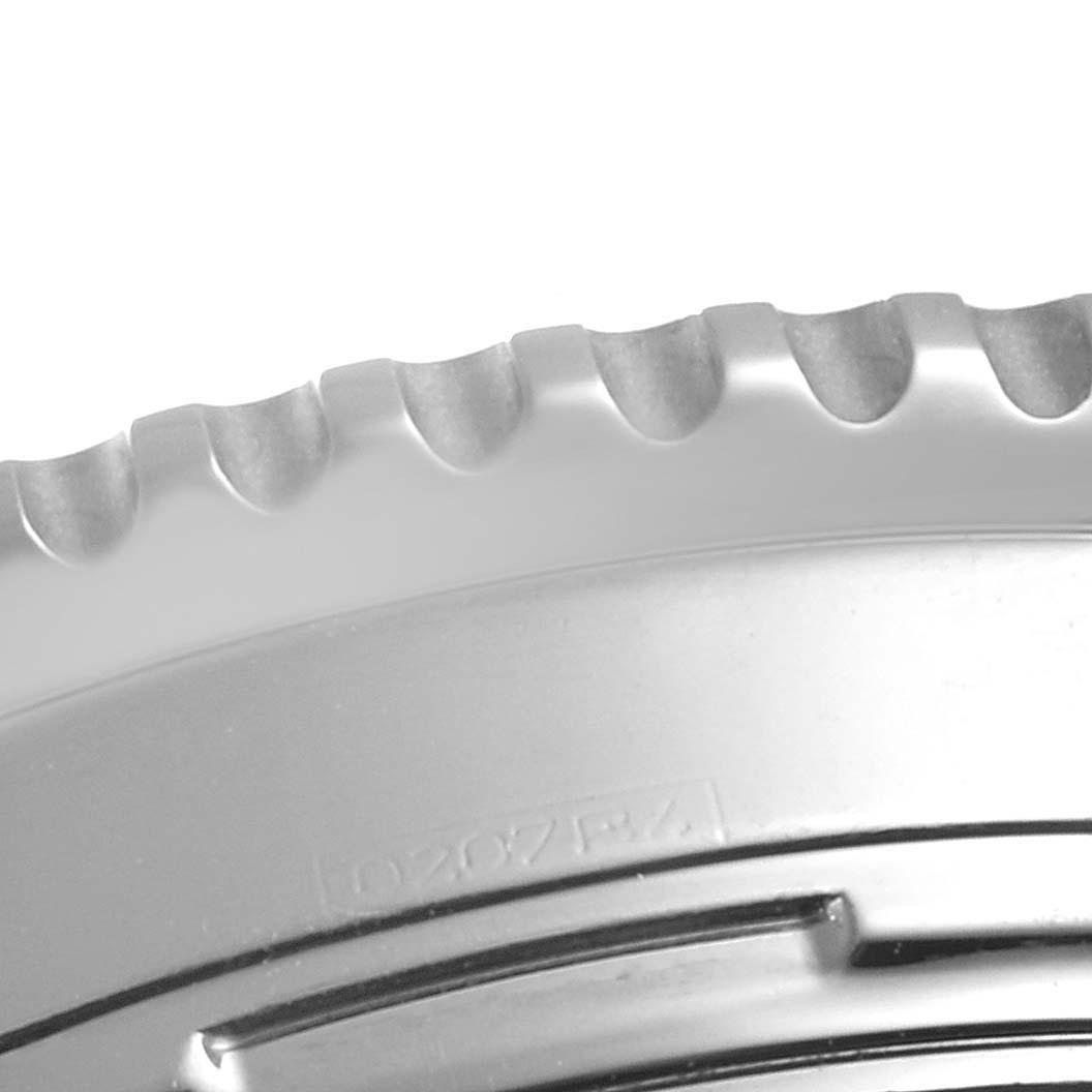 This close-up image shows the serrated edge of the bezel part of a Breitling Navitimer A23322 Men's Stainless Steel Black Dial A23322 Men's Stainless Steel Black Dial watch.