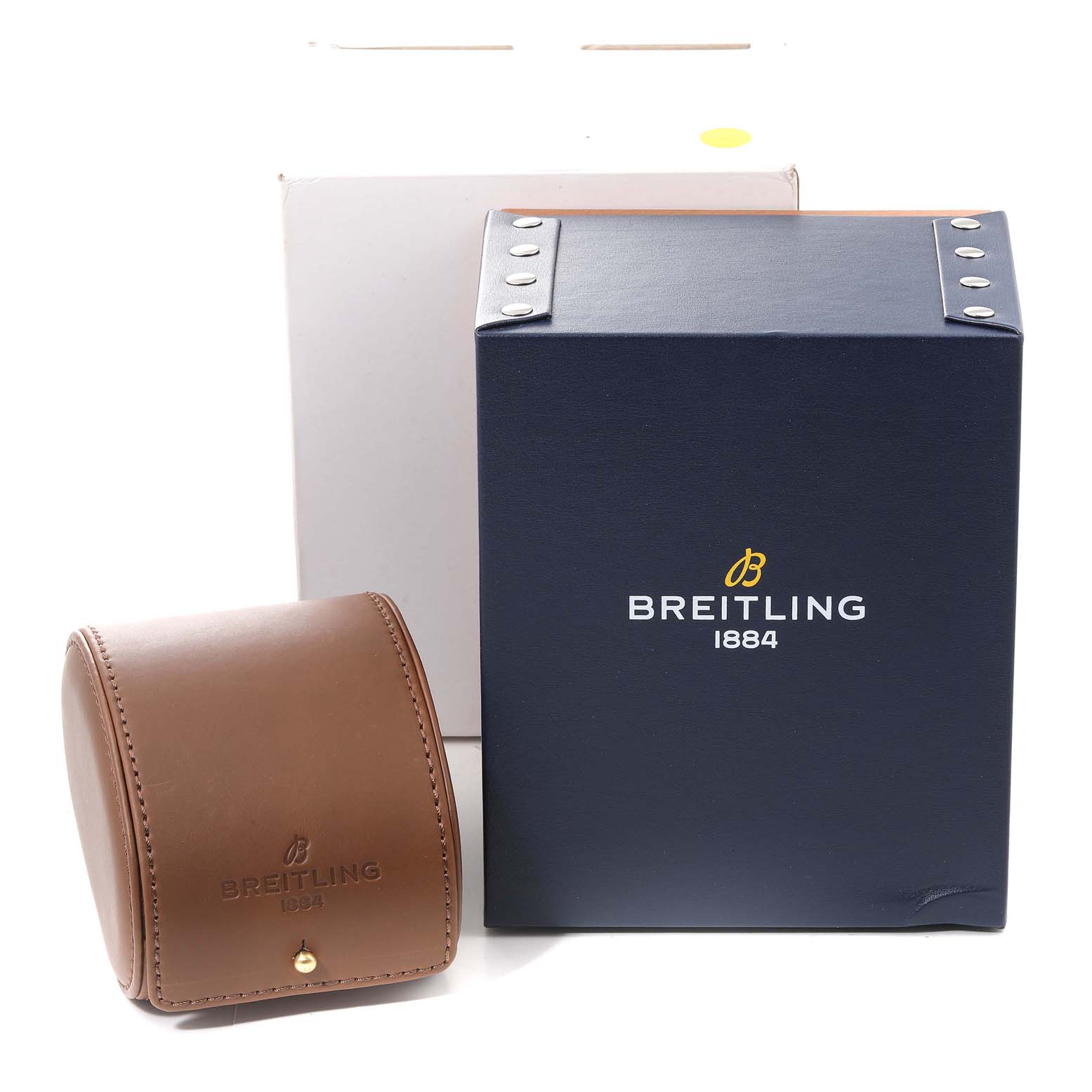 The image shows the packaging for a Breitling Navitimer A13324 Men
s Stainless Steel Black Dial A13324 Men
s Stainless Steel Black Dial watch, including a navy box and a brown leather travel case.