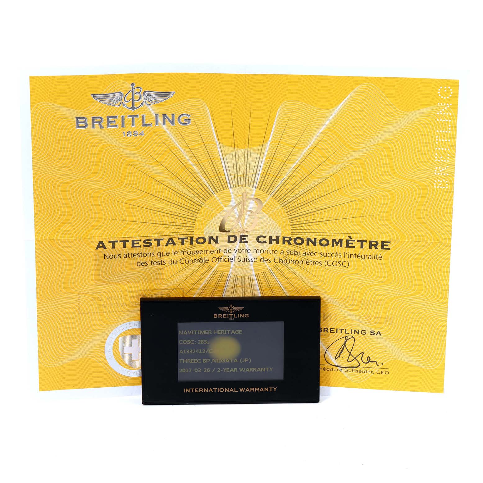 The image shows the international warranty card and certificate for the Breitling Navitimer A13324 Men
s Stainless Steel Blue Dial A13324 Men
s Stainless Steel Blue Dial model.