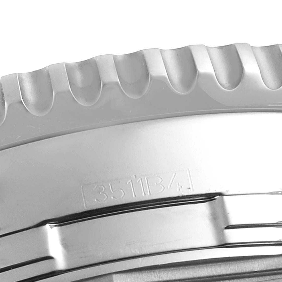 The image shows a close-up angle of the bezel and part of the case of a Breitling Navitimer A24322 Men
s Stainless Steel Blue Dial A24322 Men
s Stainless Steel Blue Dial watch.