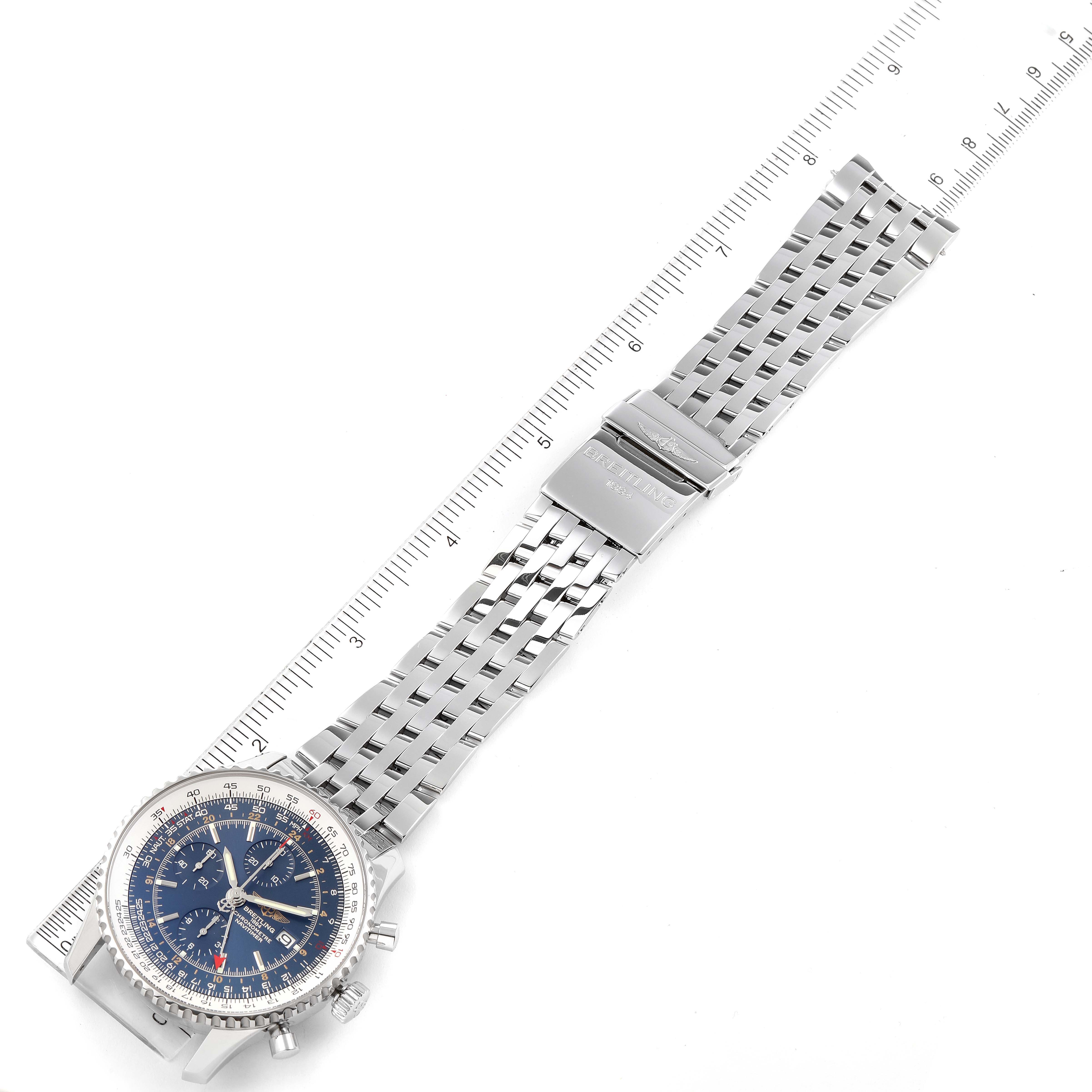 The image shows a Breitling Navitimer A24322 Men
s Stainless Steel Blue Dial A24322 Men
s Stainless Steel Blue Dial watch laid flat, highlighting its dial, bezel, crown, and metal bracelet with a ruler beside it.