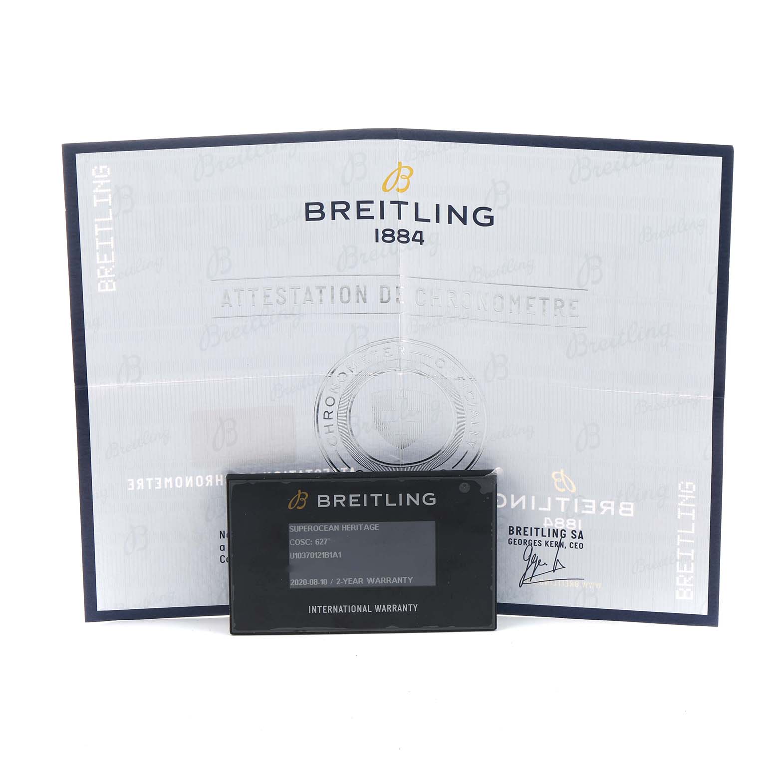 The image shows a Breitling Superocean U10370121B1A1 Men's Stainless Steel Black Dial warranty card and chronometer certificate at a frontal angle.